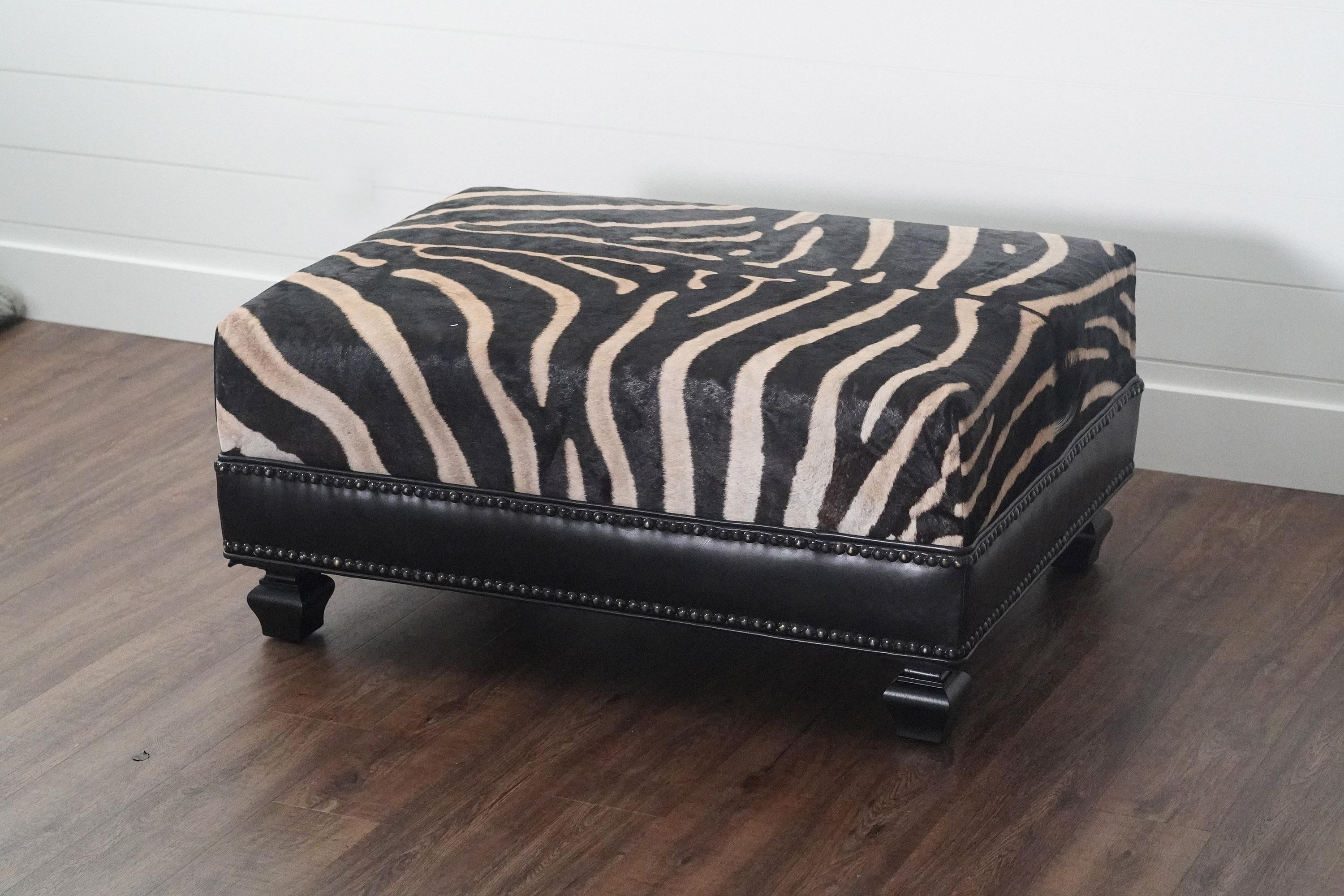 Made to order!!! Beautiful Burchell Zebra Hide top with Vegan Leather Mid lining ottoman that looks absolutely spectacular with almost any interior. Lead time to produce this ottoman with all our customers is 4-6 weeks and can offer slight