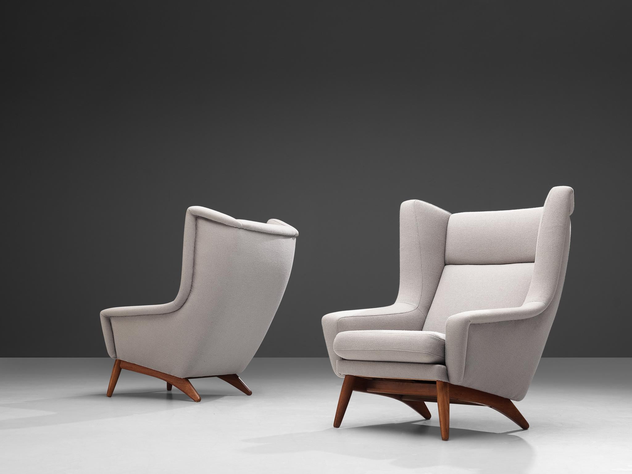 Pair of lounge chairs, teak, off-white upholstery, Denmark, 1950s

This Scandinavian Modern lounge chair is characterized by a stylish timeless design based on elegant shapes and clean lines. The slightly wing-shaped ears bring a more open and