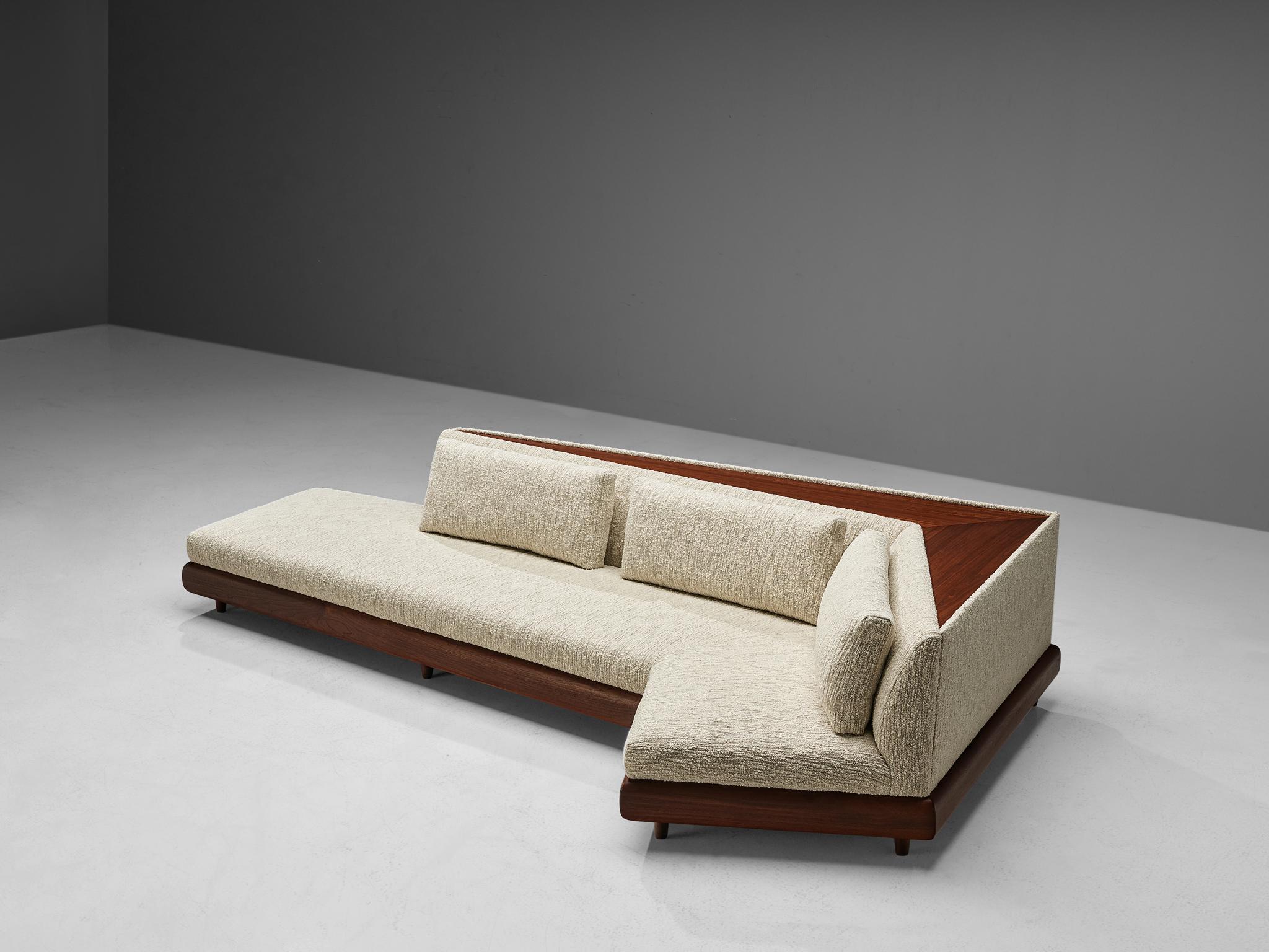 Adrian Pearsall, 'Boomerang' sofa, in cream white textured upholstery and walnut, United States, 1960s

This boomerang sofa has a unique shape with sharp and geometric lines which create a monumental look. The contrasting soft tones of the cream