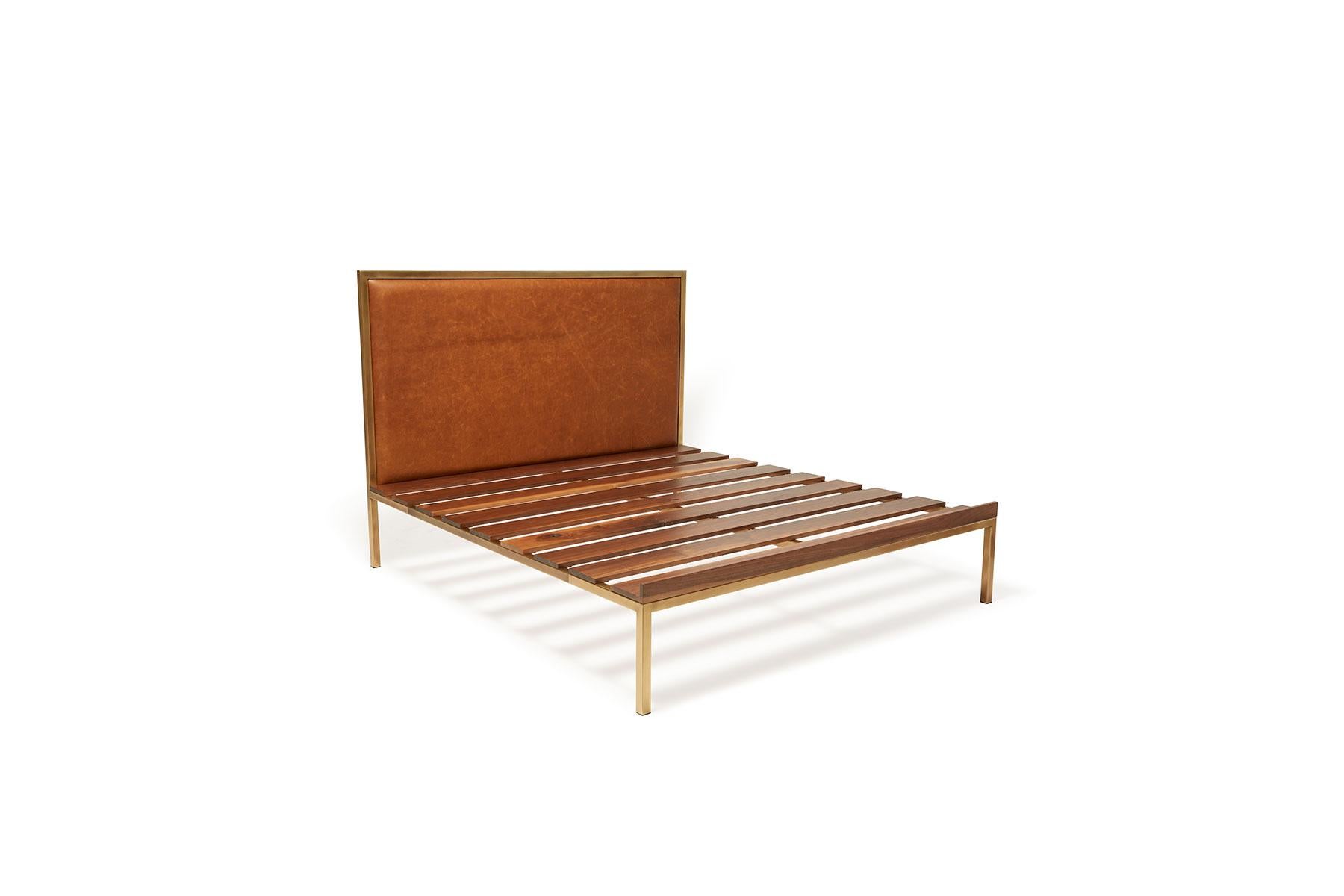 Rest with style in the Stephen Kenn Inheritance Bed. 

This minimalist variation does not feature the built-in bedside tables or bench. 

Beginning with an antique brass tubular steel frame, walnut wood slats are laid down the length of the
