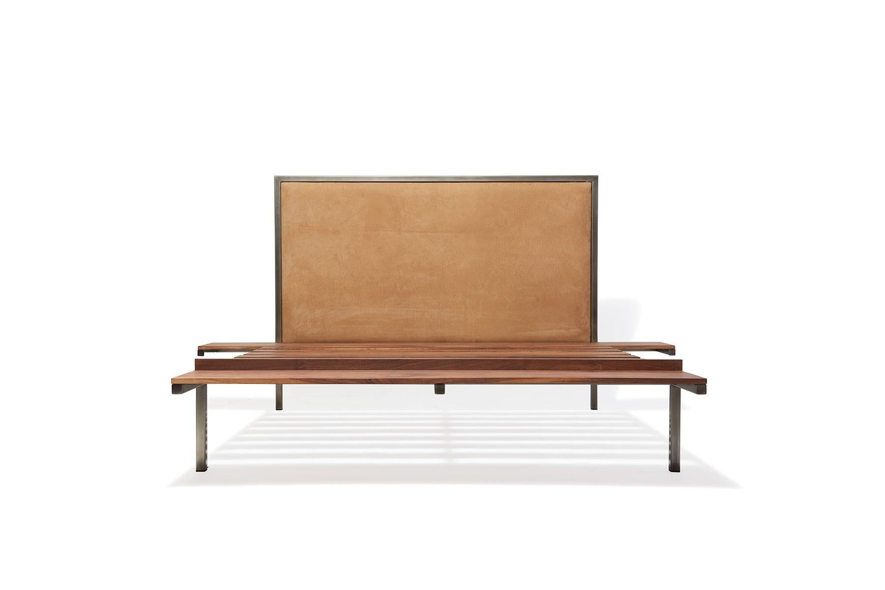 Rest with style in the Stephen Kenn Inheritance Bed. Streamlined and simple, the bed is designed serves three furnishing purposes with integrated side tables and a foot bench.

Beginning with an antique nickel tubular steel frame, walnut wood slats