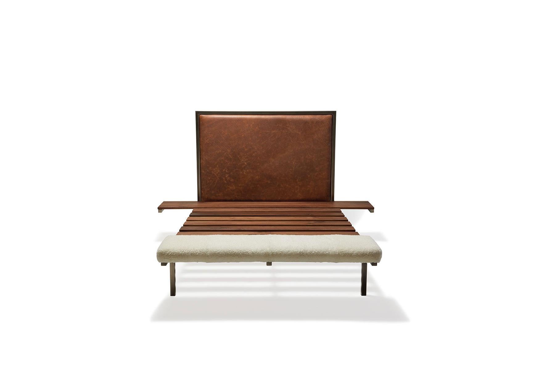 Rest with style in the Stephen Kenn Inheritance Bed. Streamlined and simple, the bed is designed serves three furnishing purposes with integrated side tables and a foot bench. 

Beginning with an antique nickel tubular steel frame, walnut wood