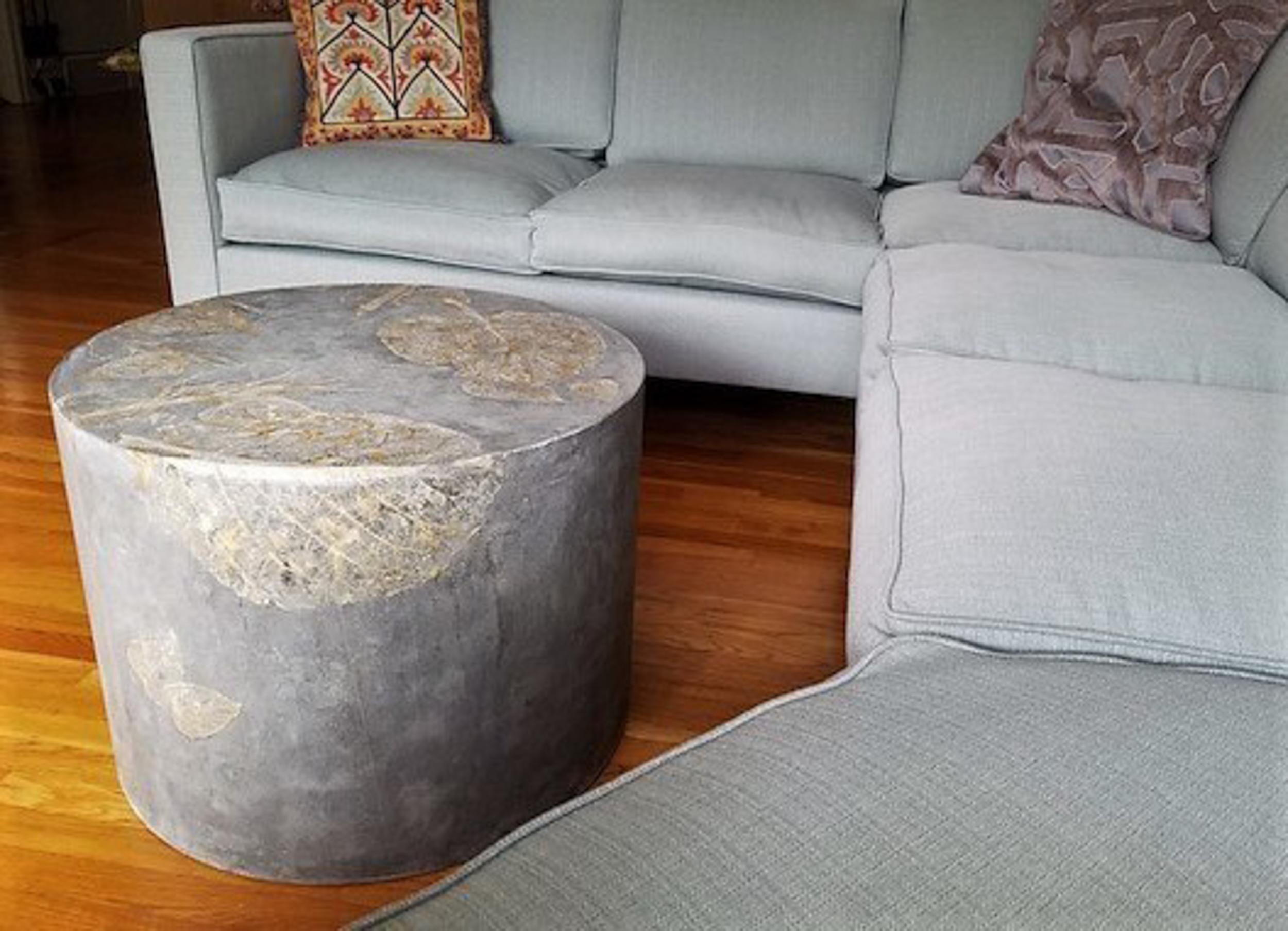 These highly customizable mid-weight round concrete coffee tables with leaf impressions from real leaves can make a natural addition to nearly any room or outdoor environment. The fossil-like leaf imprints soften the brutalist material of cement