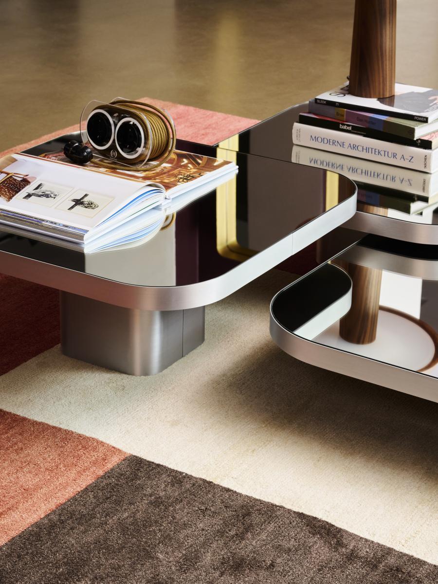 Inspired by 1970s lines and designs, Brazilian Guilherme Torres presents a side table or coffee table of casual elegance. The metal-covered surface of the body also quotes futuristic designs of the era, but it is a clearly contemporary design. The