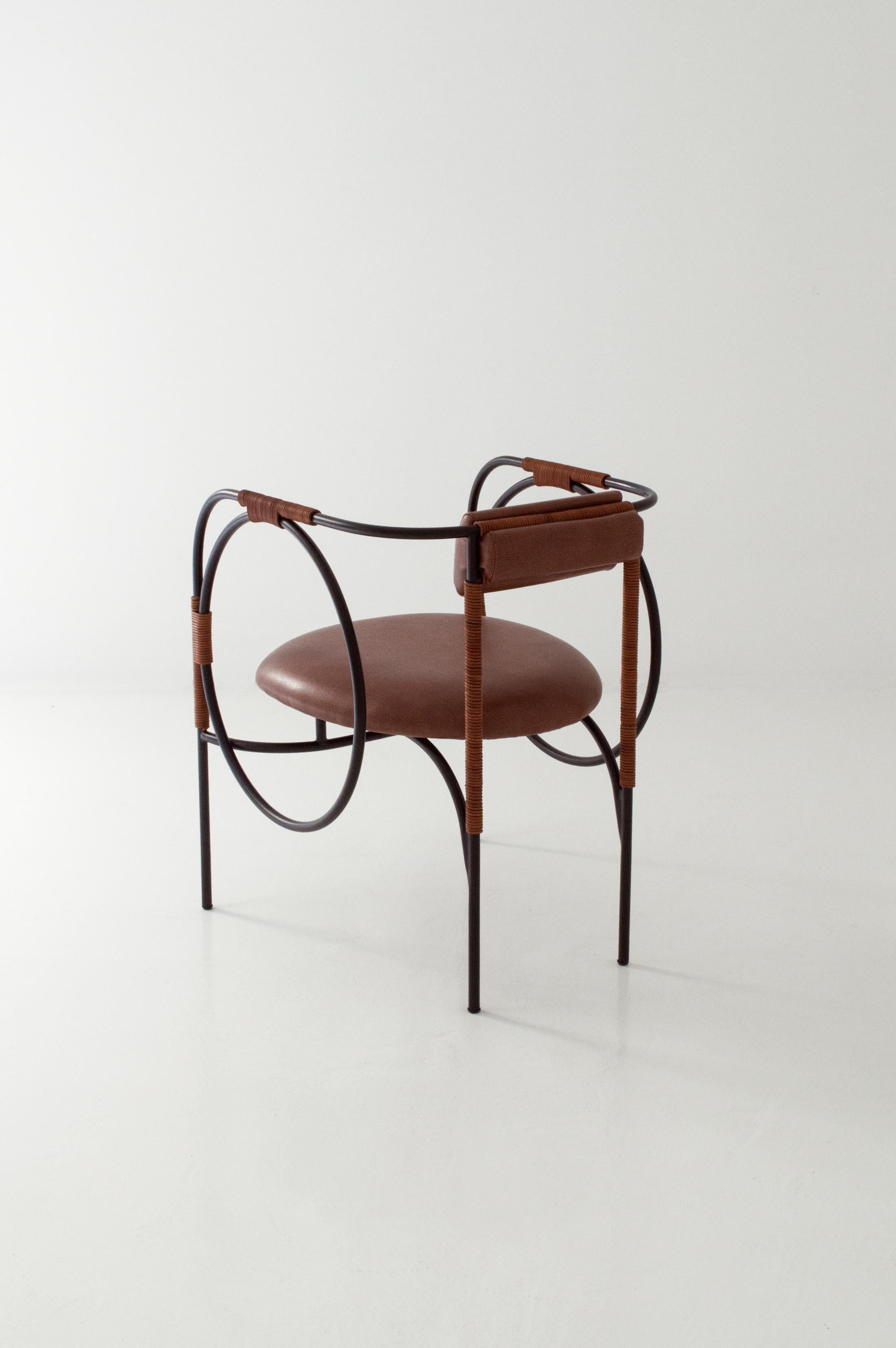 Trotter is the first piece in ACOOCOORO's new steel and leather seating series, partially informed by equestrian sports' paraphernalia. The rolled steel structure turns and travels in a seemingly endless loop, supporting the repurposed leather cords