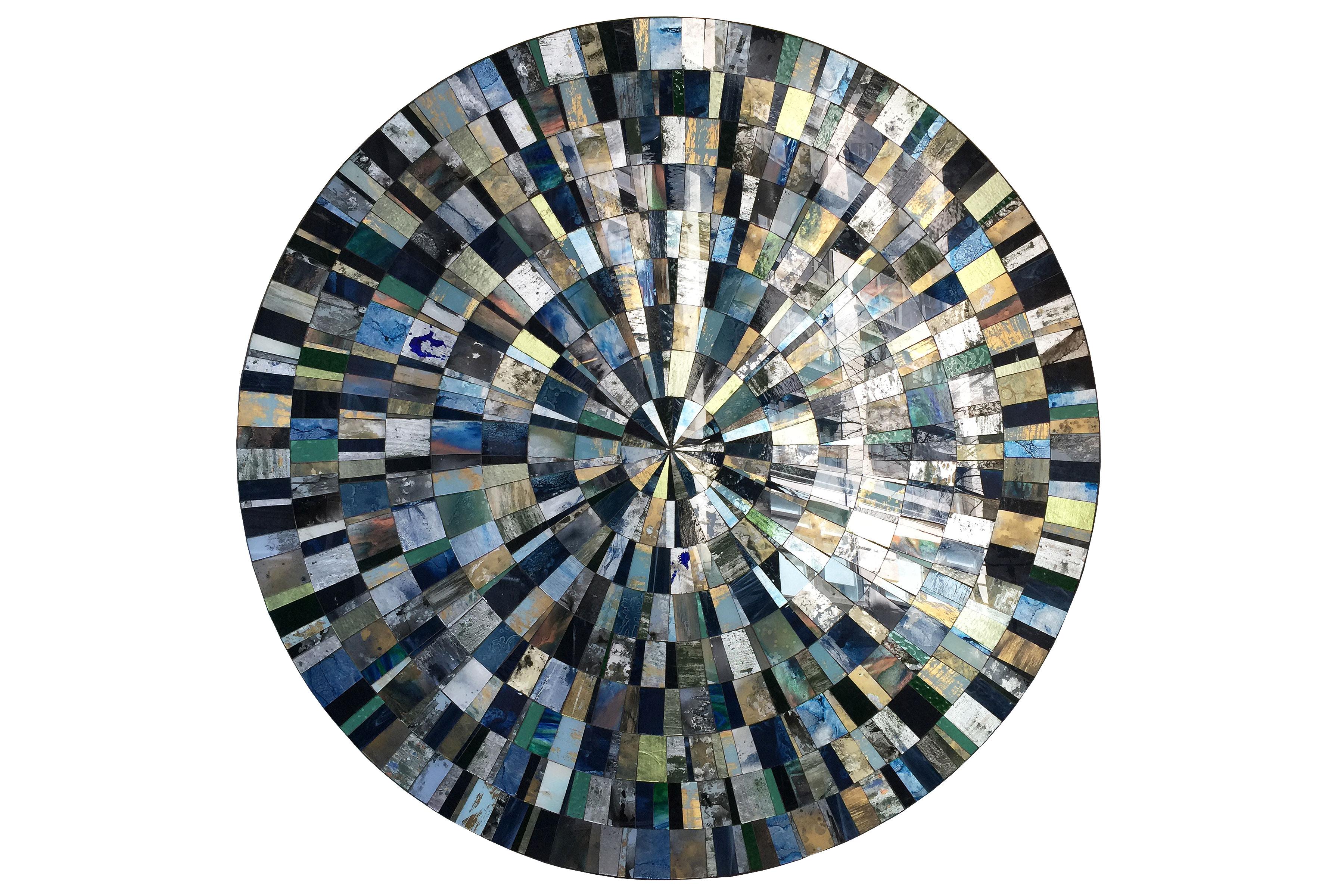 Aqua (églomisé) mosaic coffee table designed by Ercole Home with hand painted glass mosaic surface in Sunburst pattern.
The base is made of 1/2