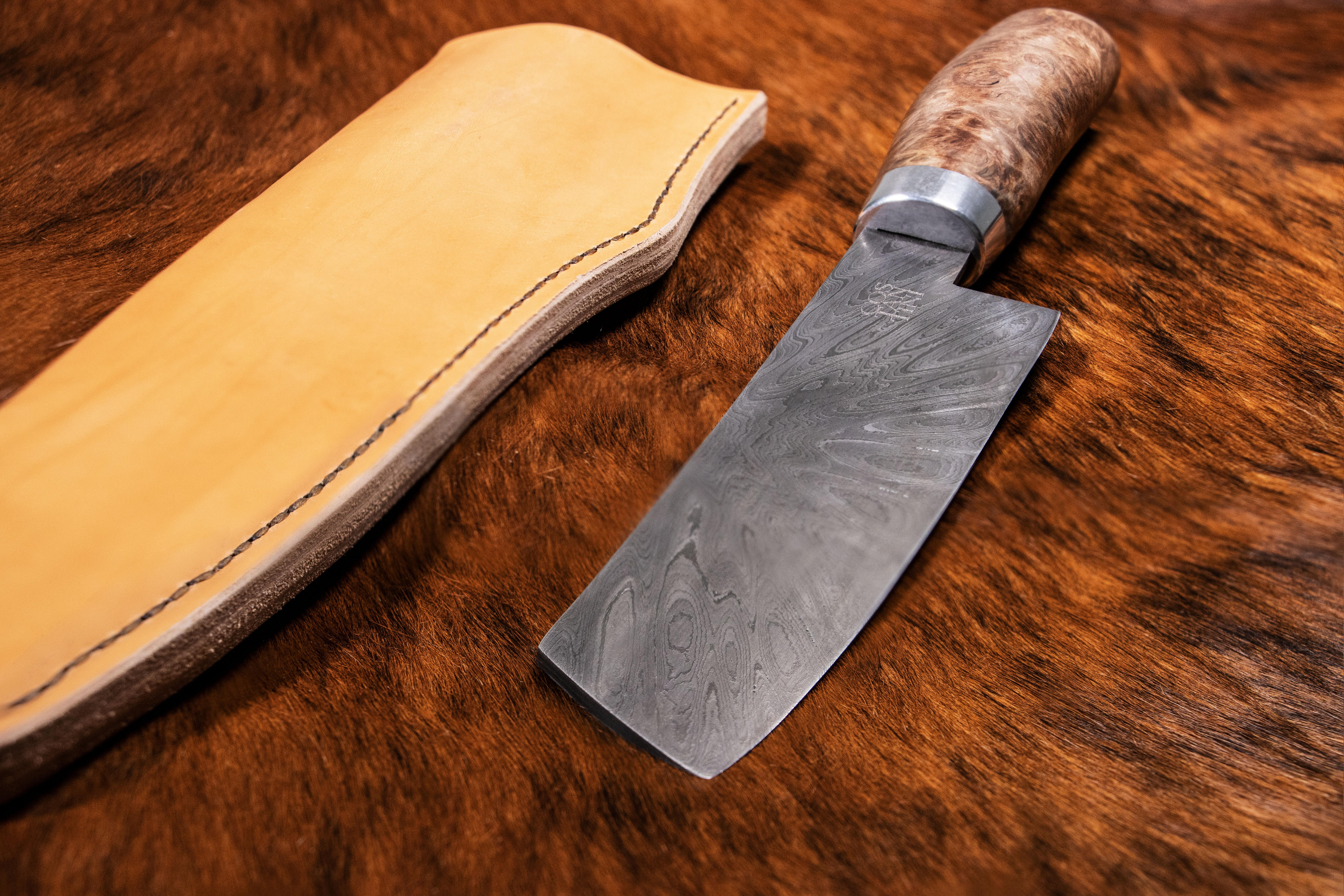 Customizable forged culinary Damascus Steel Knife from Costantini Design.

This handmade knife is available as shown or with a San Mai blade, and the handle is available in various woods, inquire for details.

Measurments are 11.5