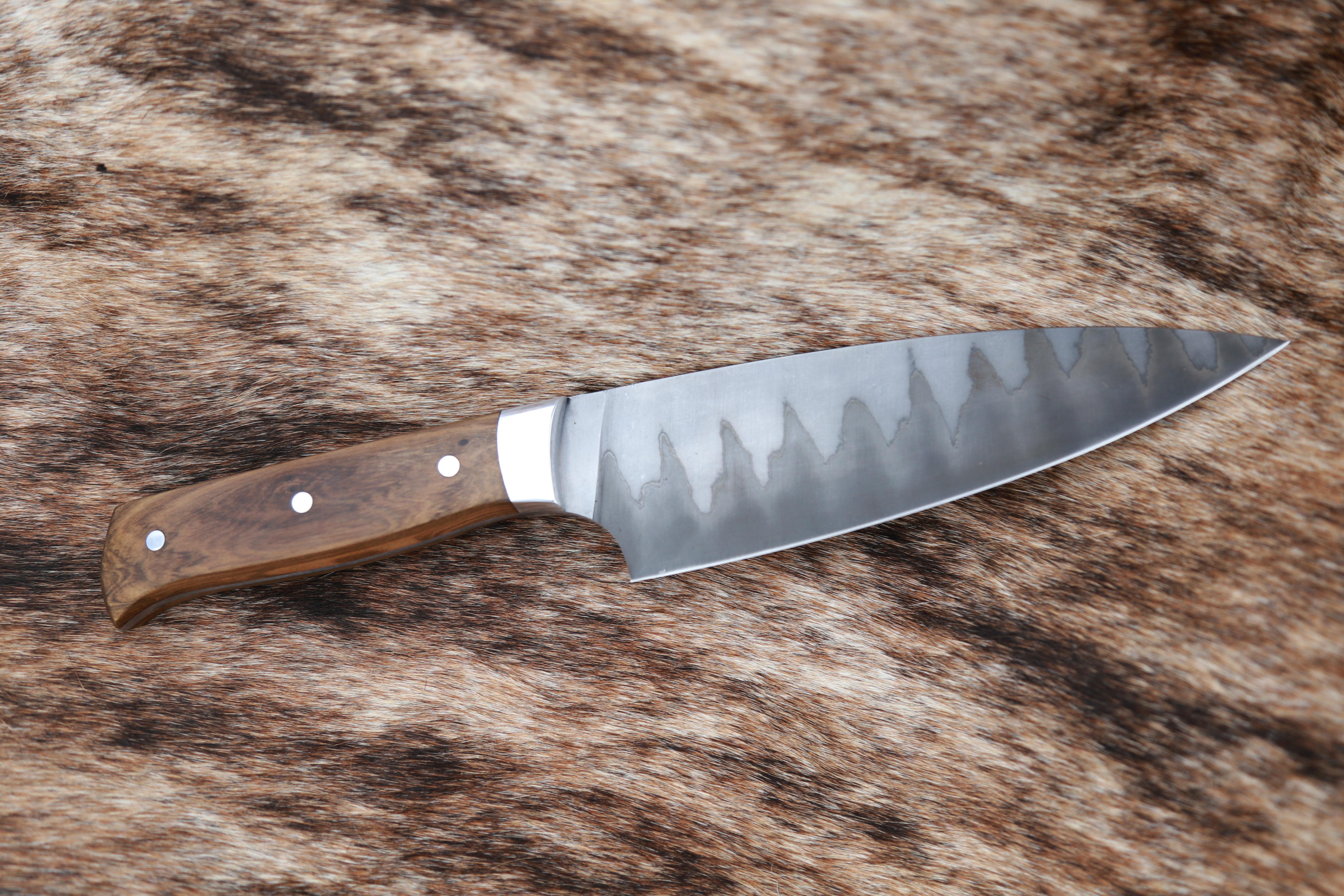 Customizable forged culinary San Mai Steel Knife from Costantini Design.

This handmade knife is available as shown or with a Damascus blade, and the handle is available in various woods, inquire for details. 

About Costantini Design
