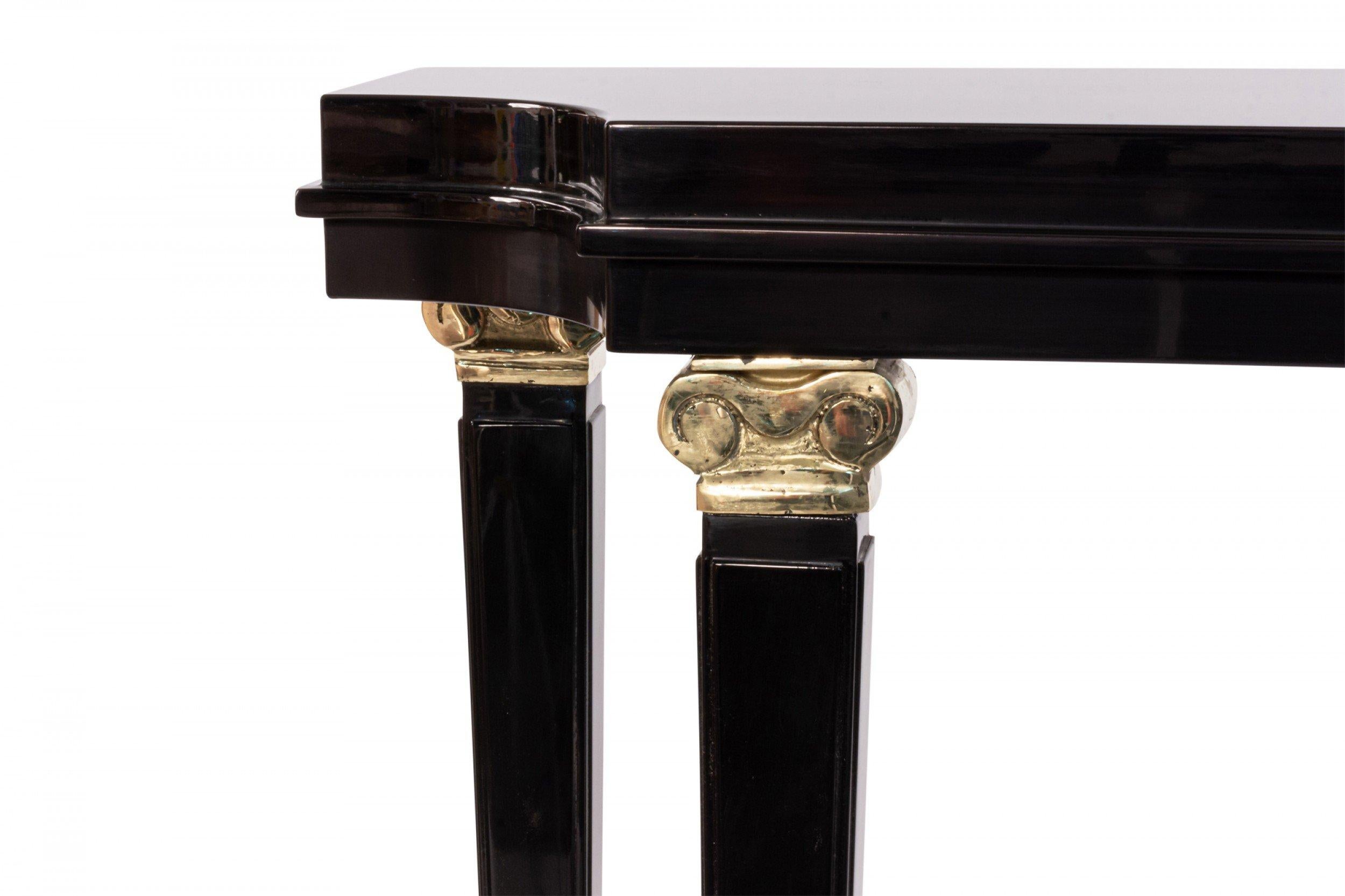 Contemporary French mid-century 1940s-style black lacquer shaped top console table with shelf and bronze capital trim on legs (made to order, custom size and color available).
     