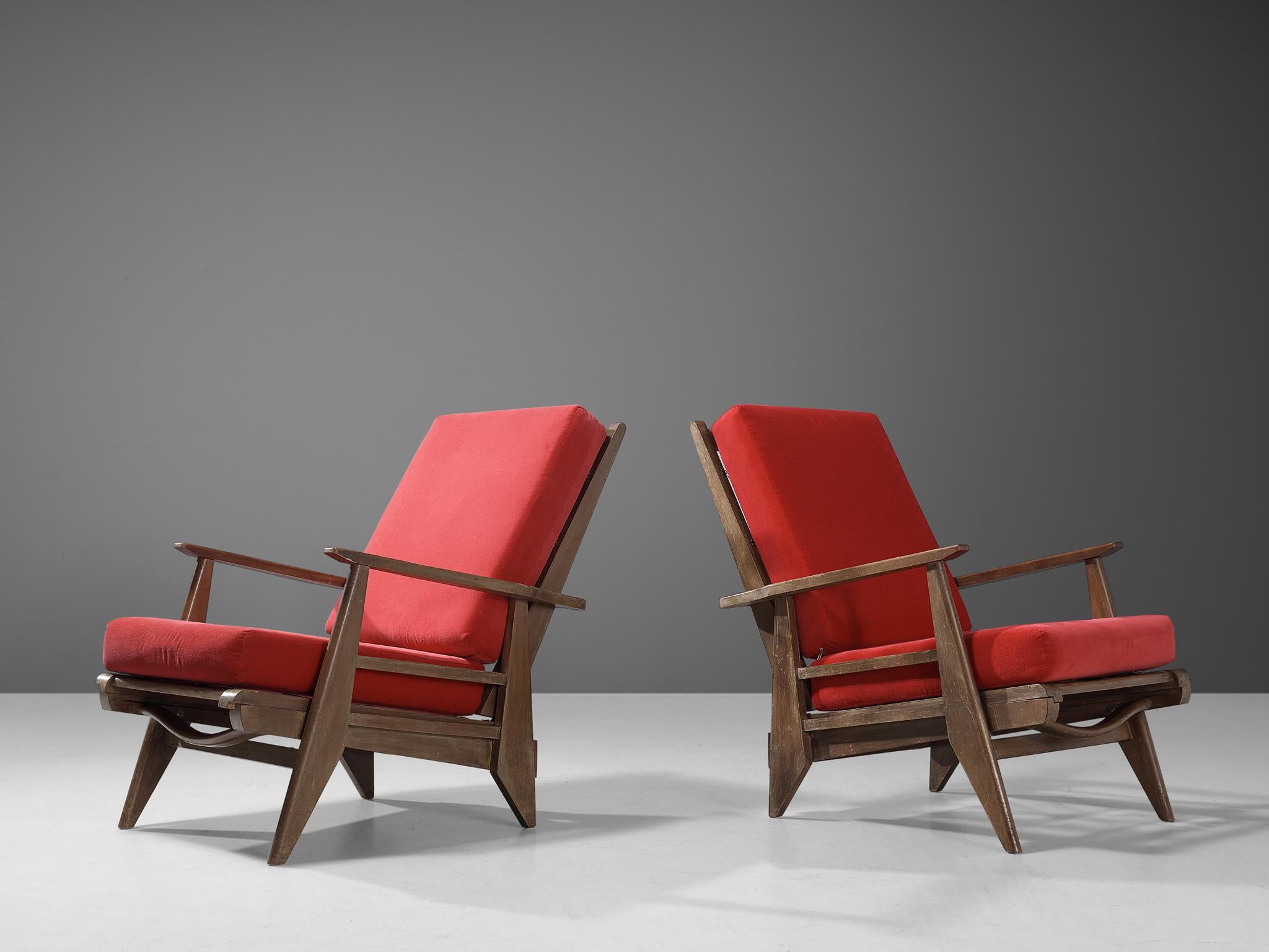Pair of armchairs, beech, metal, fabric, France, 1950s 

These armchairs strongly remind of the iconic chairs created by the talented French designer René Gabriel (1899-1950), who is known for his reconstructivist approach to furniture design. The