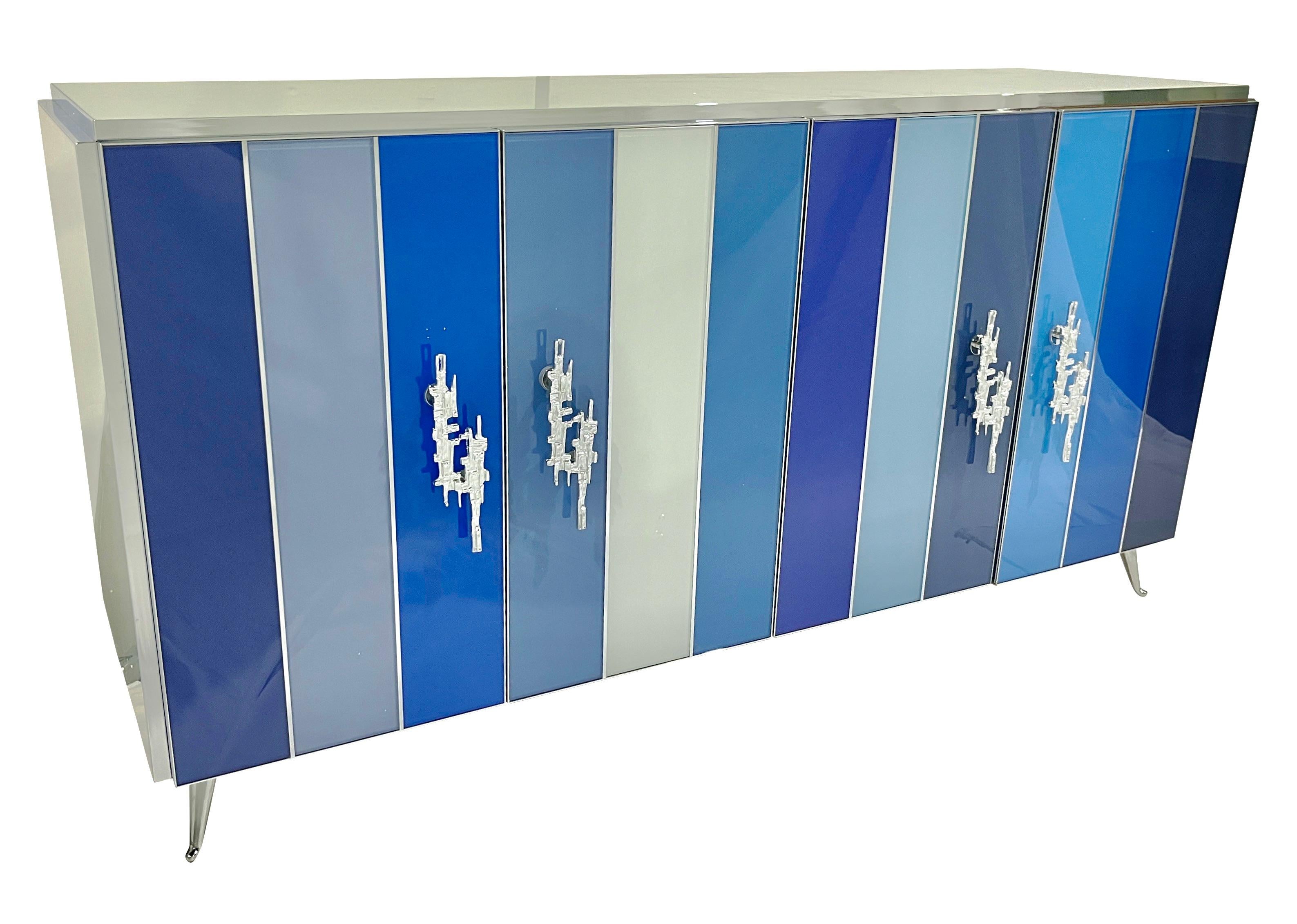 Bespoke custom made 4-door credenza/sideboard entirely handcrafted in Italy with elegant post modern decor, the surround decorated with art glass in an enticing striped light blue, sky blue, sea blue, turquoise, cobalt, shades of grays and white,
