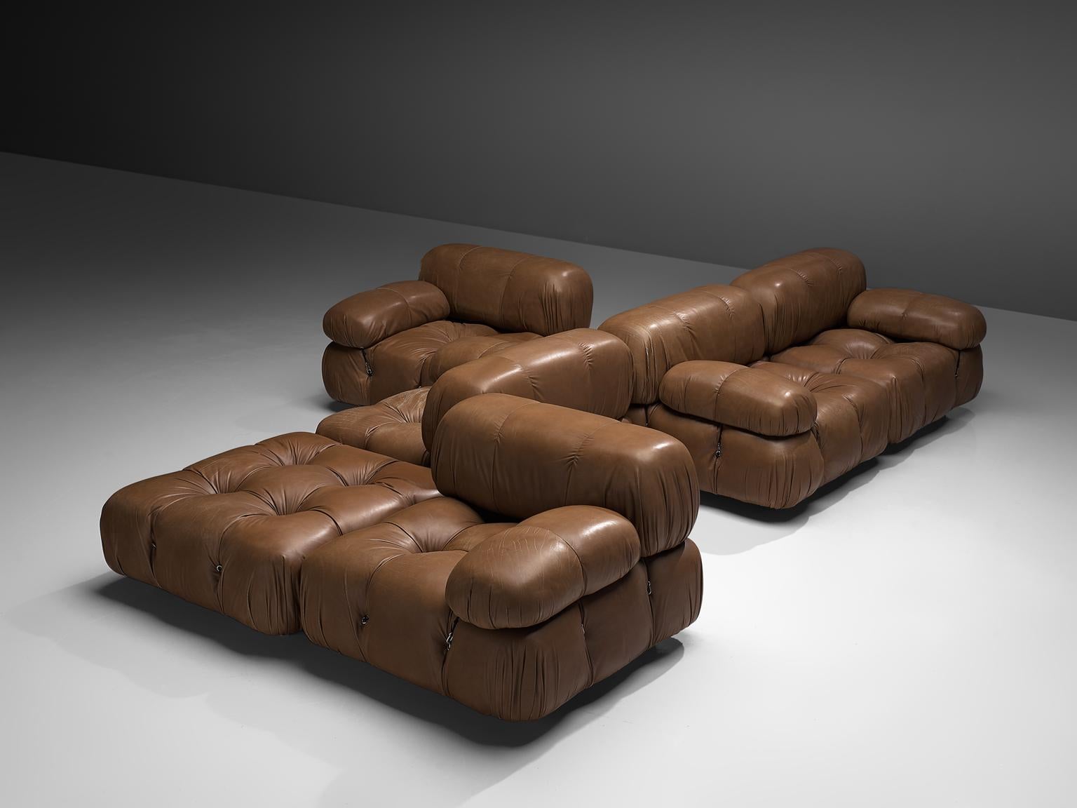 Mario Bellini, modular 'Cameleonda' sofa in original brown leather, Italy, 1972.

The sectional elements of this can be used freely and apart from one another. The backs and armrests are provided with rings and carabiners, which allows the user to