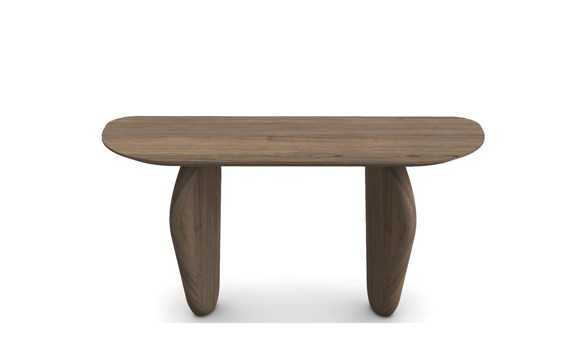 This elegant and stylish console, crafted from solid wood, evokes the enduring presence of monolithic stones and sculptures. Each piece is handcrafted with meticulous attention to detail, reflecting a commitment to high-quality materials and