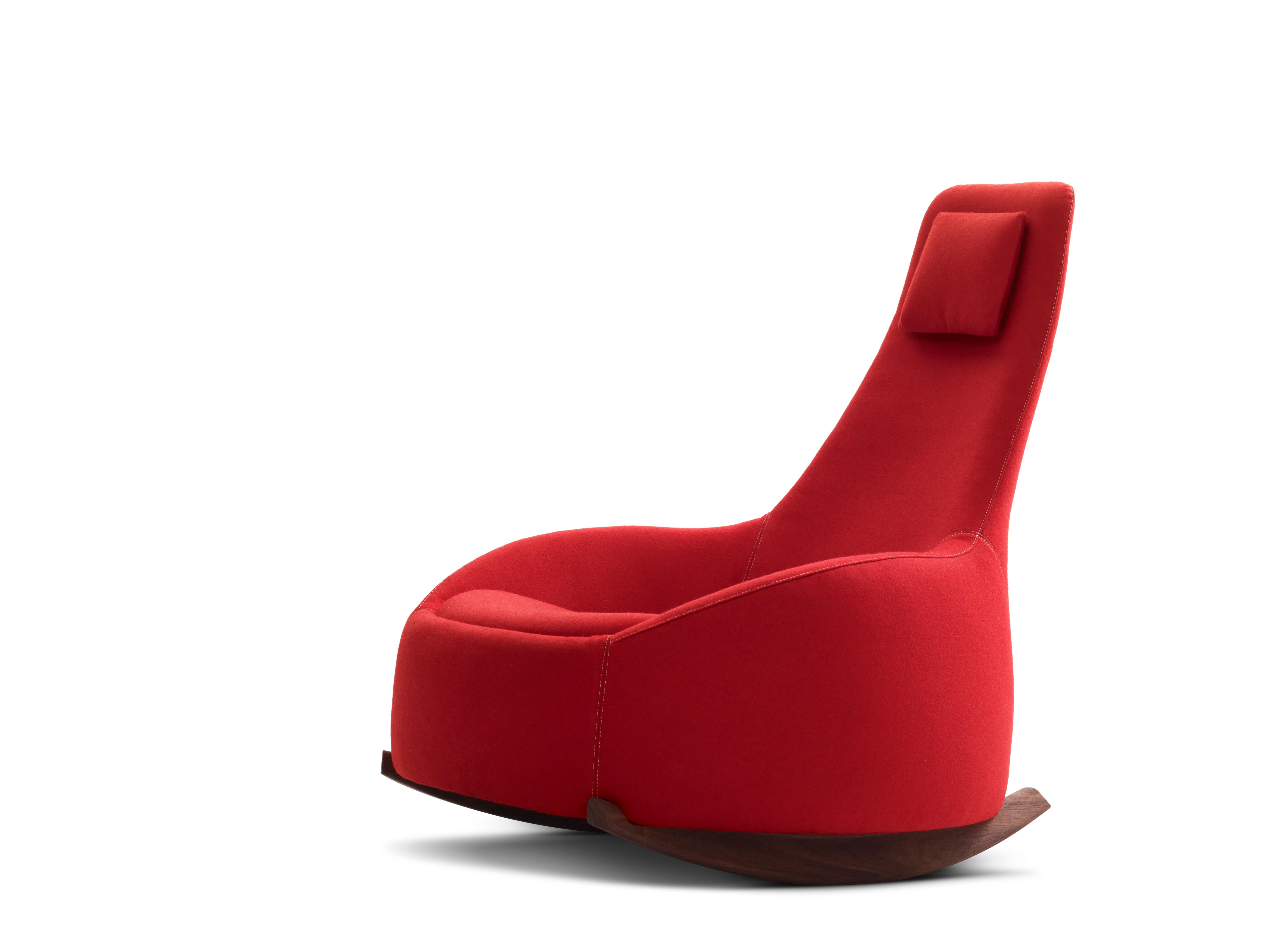 The narrow back bends to the wider shape of the arm and the seat. This reminds of a spoon with which you eat Dim Sum with.

Studies show that the rocking chair provides more than physical and mental health. The relaxation that arises from the rhythm