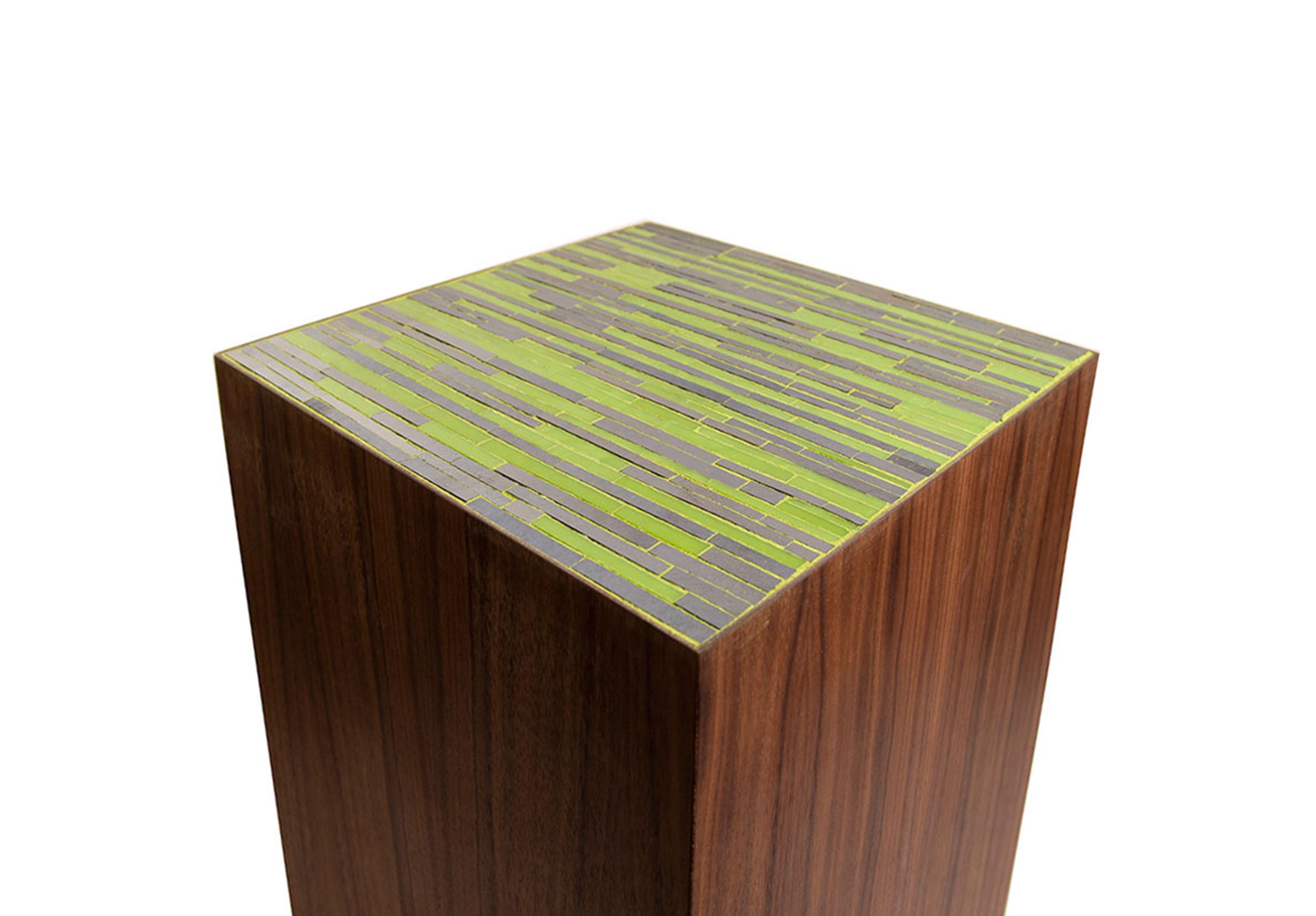 The Natura Pedestal by Ercole Home has a natural wood finish on walnut. Handcut glass mosaics in apple green and black mother of pearl glass mosaic decorate the top surface in Facets pattern.
Custom sizes and finishes are available.
Made in New York
