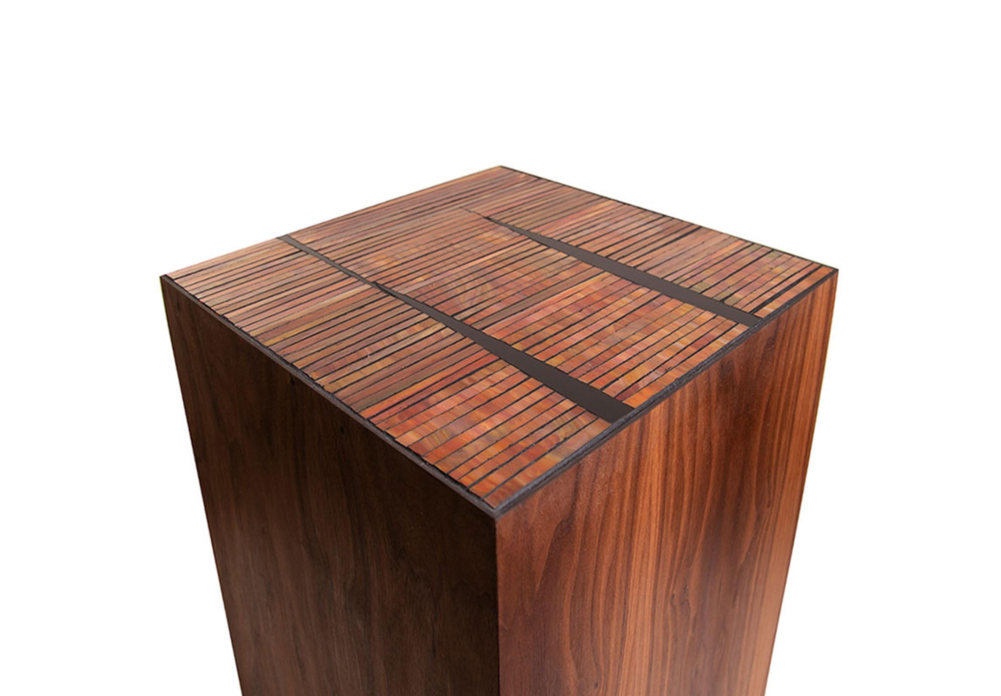 The Natura Pedestal by Ercole Home has a natural wood finish on walnut. Hand-cut glass mosaics in orange/ red and black glass mosaic decorate the top surface in our Sycamore pattern.
Custom sizes and finishes are available.
Made in New York