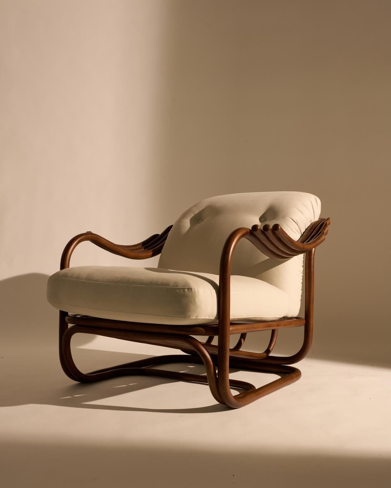Seamlessly merging the inherent beauty and
charm of natural rattan with meticulous ergonomic precision, the Poltrona Tria
Lounge Chair embodies both artistry and function. Constructed
almost solely from steam-bent rattan canes, curved and fixed into