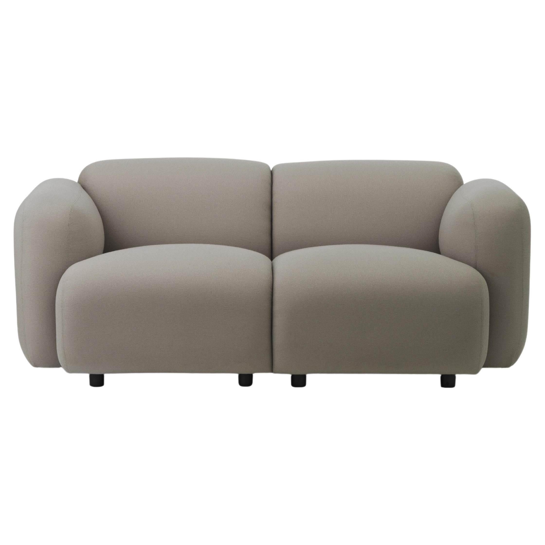 Swell Sofa
Swell is a minimalistic collection of furniture for the living room with a playful, light-hearted feel. The soft, curved silhouettes give the furniture pieces an inviting look and ensure a fantastic sitting comfort. 
The name Swell is a