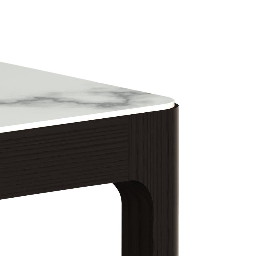 This blackened ash side table or nightstand designed and fabricated by Munson Furniture draws inspiration from midcentury designs and fits beautifully with both traditional and contemporary interiors. We've started with our signature table design