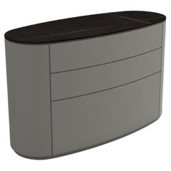 Customizable Oval Chest of Drawers In Sahara Black Ceramic & Ash Grey Lacquer