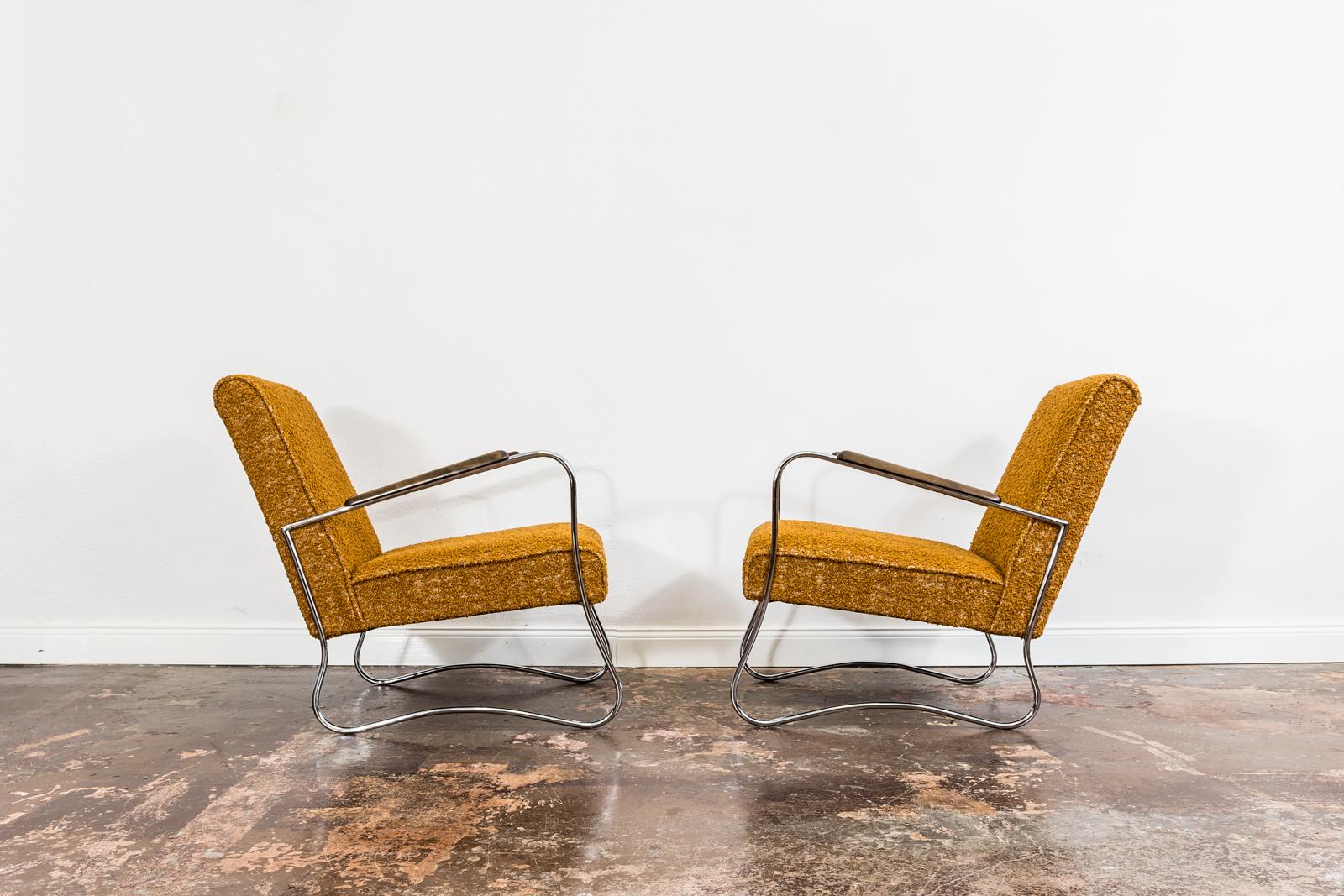 Pair of Armchairs from Fabryka Mebli Wschód in Zadziele, Poland, 1950s,
Metal frames has been rechrome, wood armrests have refinished.
Reupholstered in orange boucle type of fabric.
We offer fabric customization upon request.