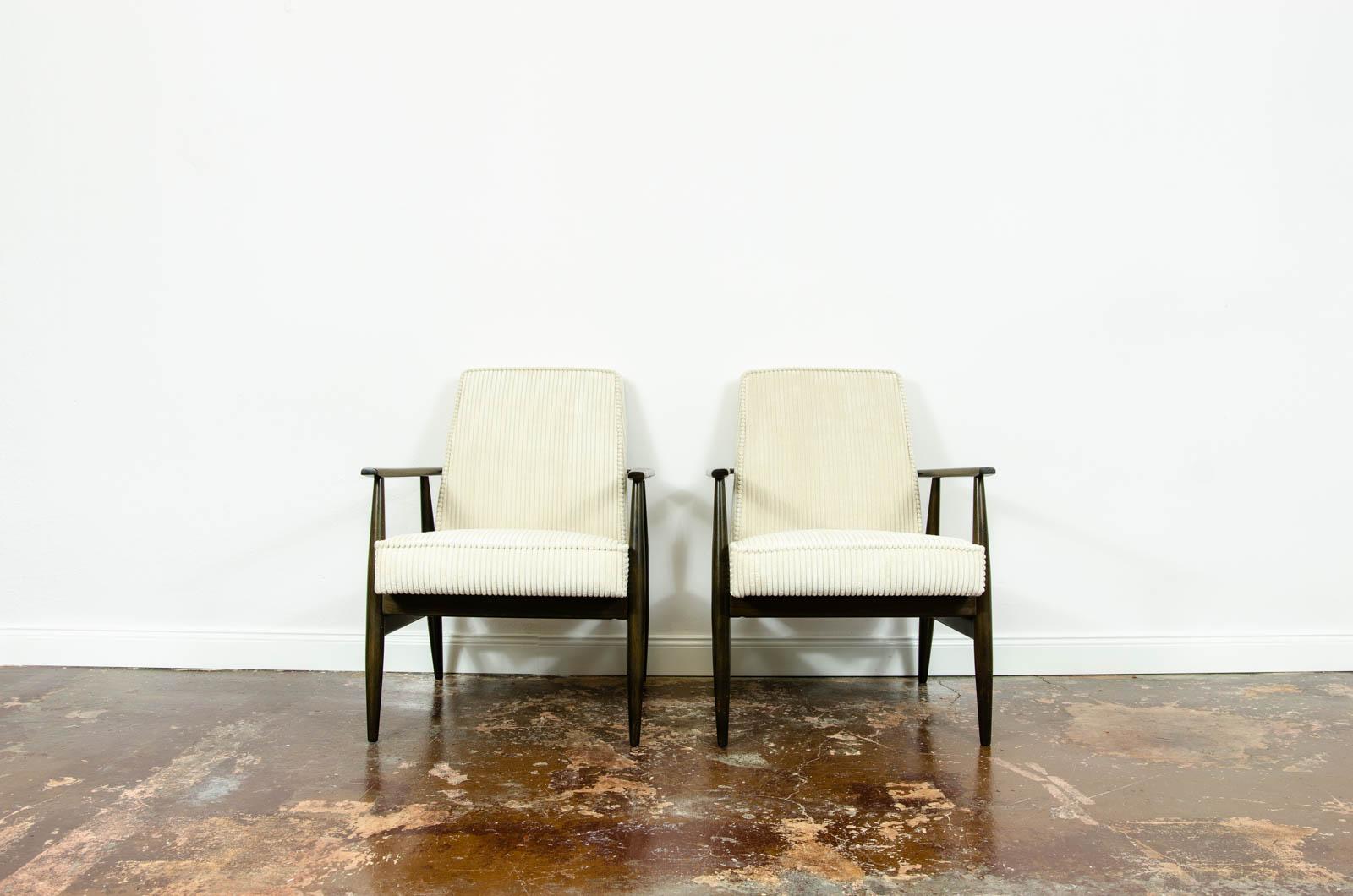 Pair of mid-century armchairs, type 300-190 designed by H. Lis, manufactured in Poland, 1960's.
Reupholstered in cream corduroy. 
Solid wood frames have been completely restored and refinished.
We offer fabric customization upon request.