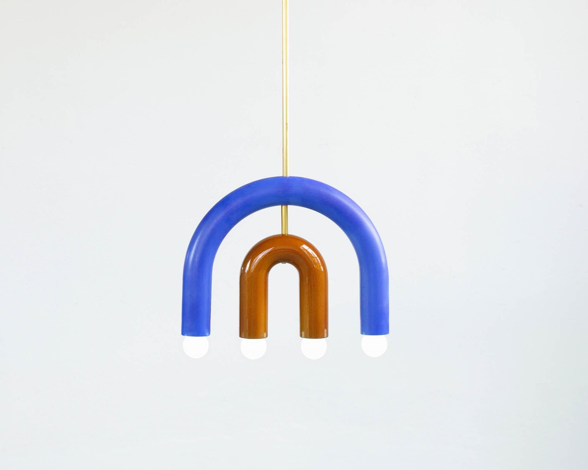 TRN C1 Pendant lamp / ceiling lamp / chandelier 
Designer: Pani Jurek

Dimensions: H. 27.5 x 35 x 5 cm
Model shown: Cobalt blue & ochre

Bulb (not included): E27/E26, compatible with US electric system

Materials: Hand glazed ceramic and brass
Rod: