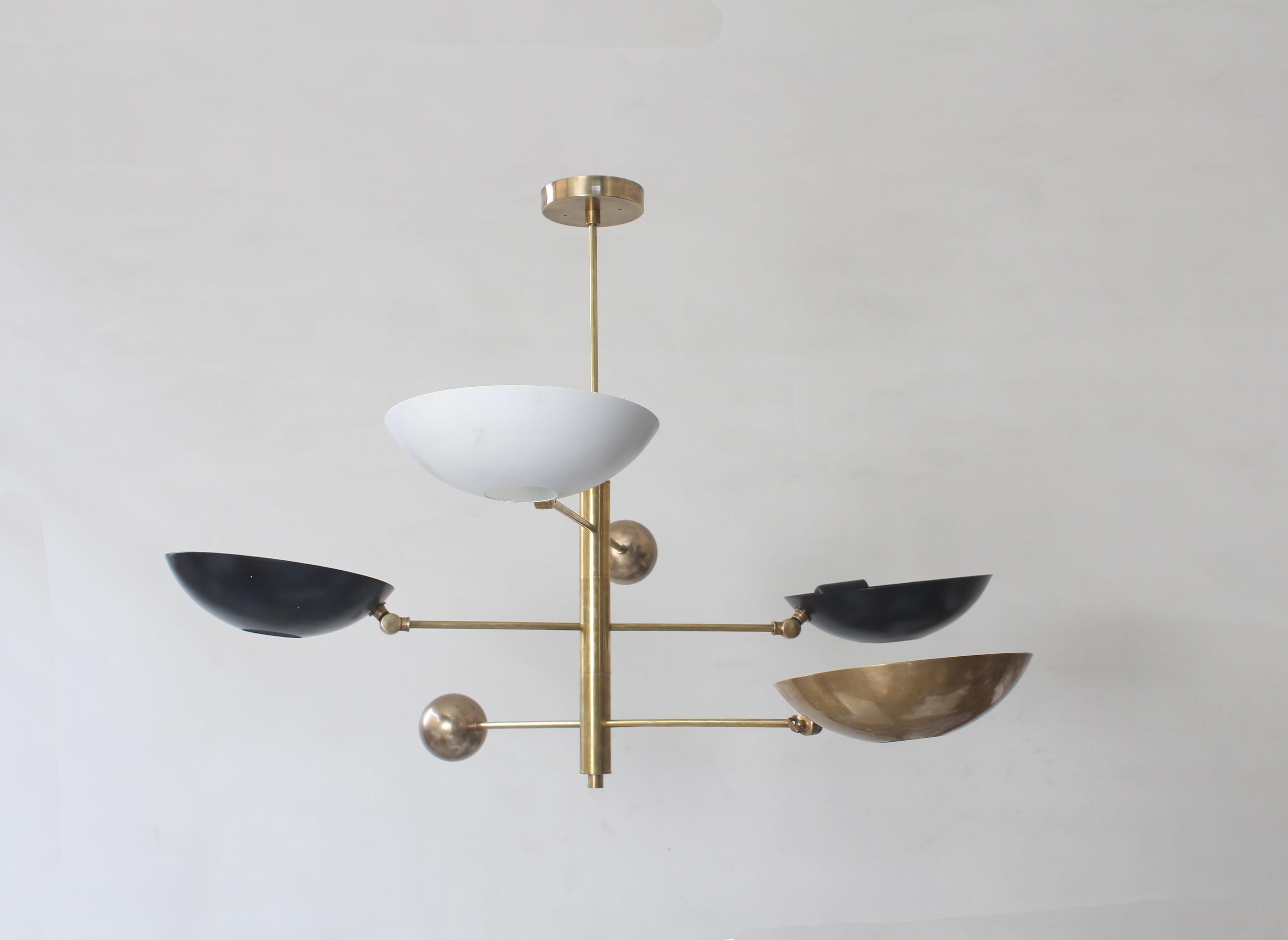 Elegant minimalist chandelier with  counter balanced  rotating arm that pivot 180 degree with  tiltable shade .

Light bounce on ceiling  creating an ambient mood  and lights  up a few thing under throught the hole in  shade . 

Shade displayed here