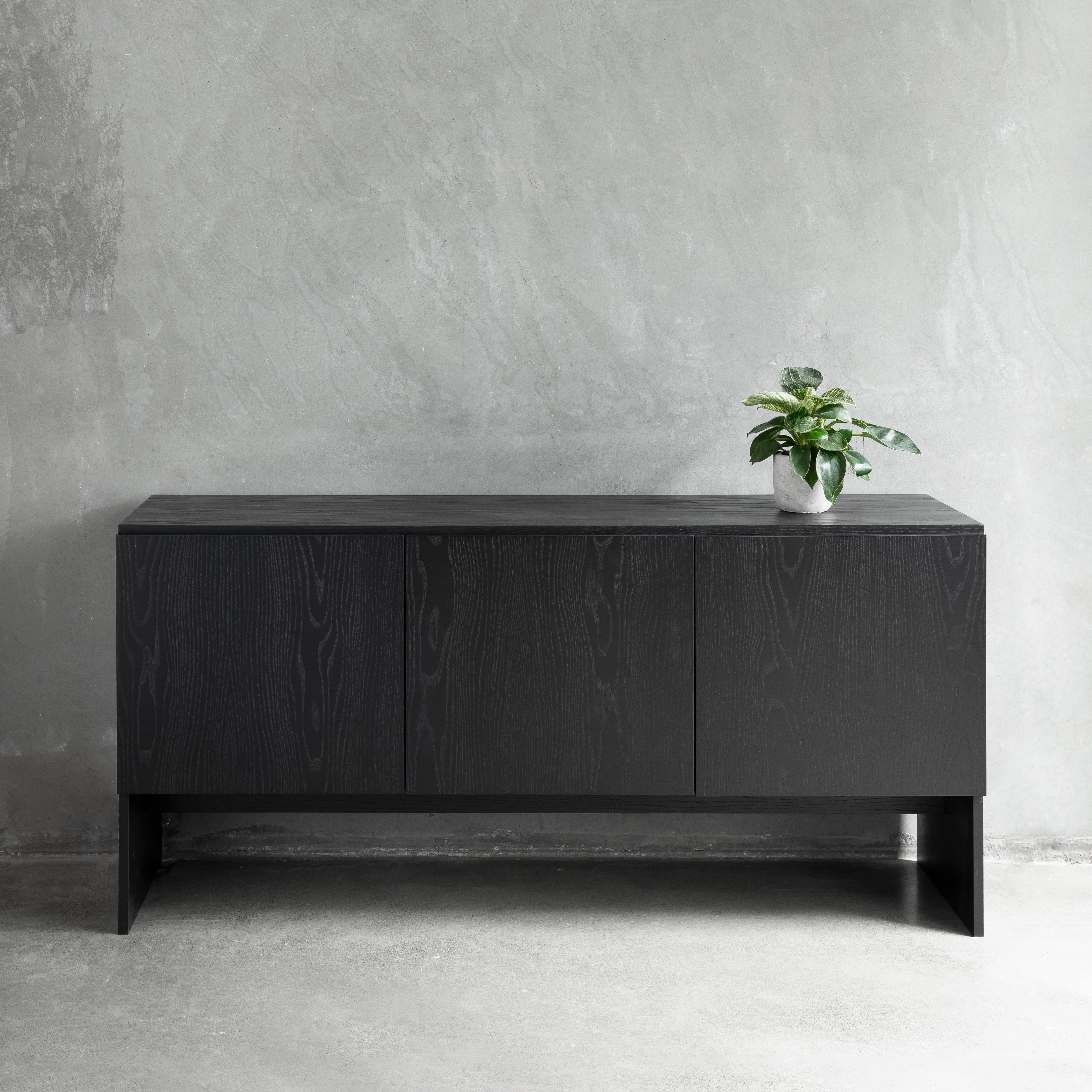 Simple in design yet sophisticated in presence, the Slab Credenza is a modern storage solution suitable for homes and office spaces.

The geometric profile of the credenza combines clean lines and angles, accentuated by the positioning of the