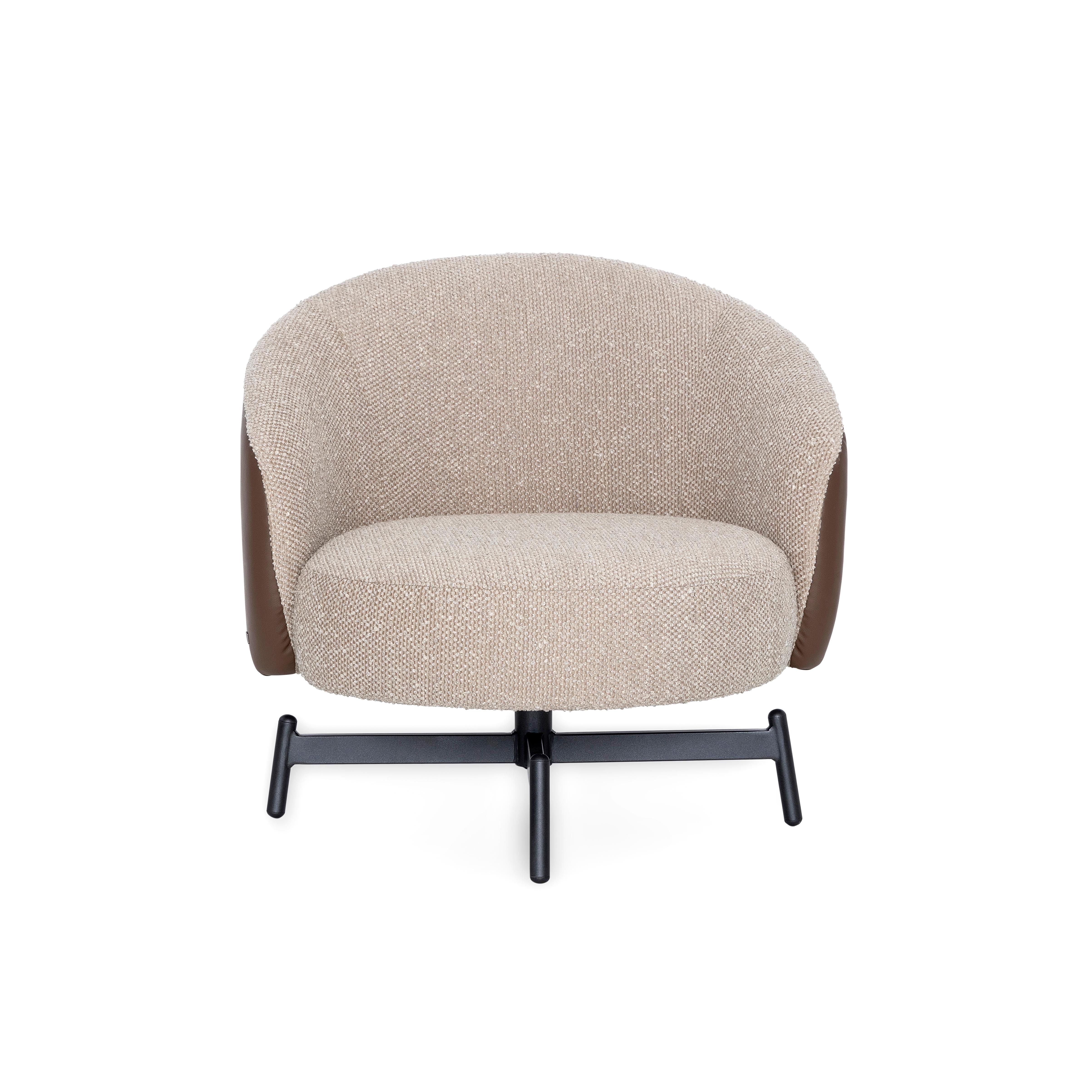 A Mule Swivel chair designed by Uultis Studio with brown faux leather, beige bouclé fabric and black metallic base. With its sculptural form and seamless blend of textures, the Mule swivel chair brings modern refinement to any living space. Inspired