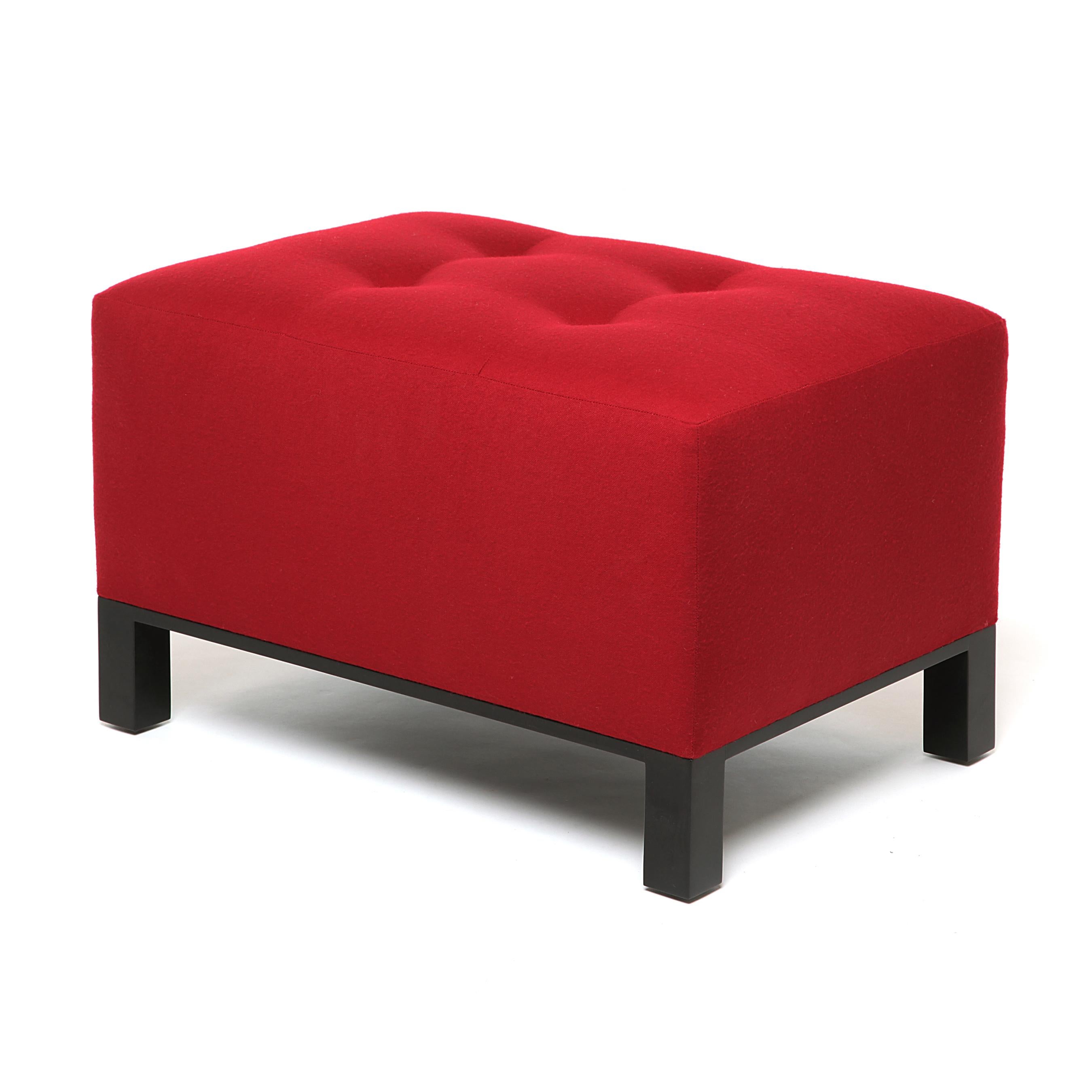 A poised piece, this simple yet energetic ottoman is another great balance of modern and traditional flair with a wide base to meet the proportions of the chair.