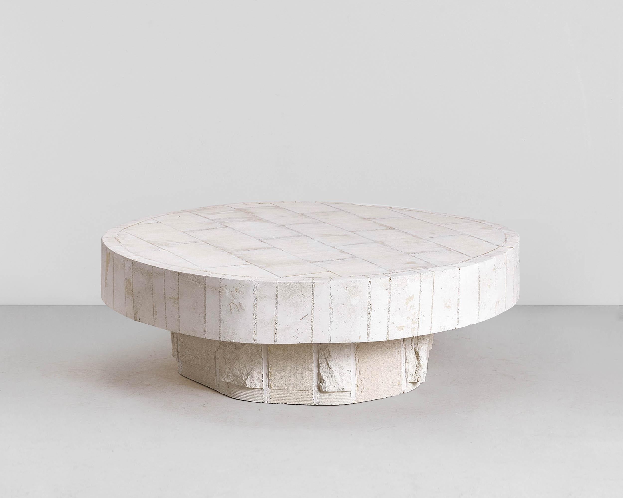 Contemporary coffee table 'Hendo' by denHolm.

Each creation is unique and signed by the artist.

Dimensions:
H. 40 cm
D. 100 cm

Material:
South Australian Limestone, sculpted entirely by hand.
---
Artist and stonemason Steve Clark is the man
