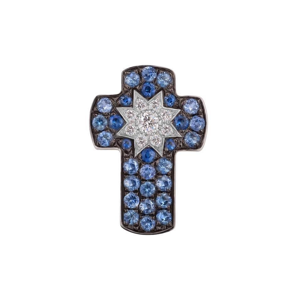 Cross White Gold 14 K (Available also Tsavorite / Blue Sapphire / Cognac Diamonds)
Diamond 1-Round 57-0,03-4/6A
Diamond 8-Round 57-0,03-4/6A 
Ruby 8-Round-0,06 (4)/3C
Pink Sapphire 21-Round-0,21 2/2C
Weight 1.01 grams

With a heritage of ancient