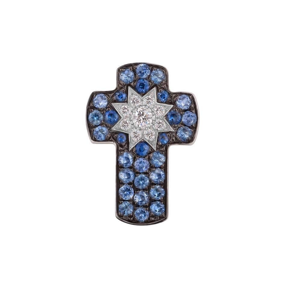 Cross White Gold 14 K (Available also Blue sapphire / Pink Sapphire / Cognac Diamonds)
Diamond 1-Round 57-0,03-4/6A
Diamond 8-Round 57-0,03-4/6A 
Tsavorite 21-Round-0,19 2/2C 
Tsavorite 8-Round-0,05 1/2C
Weight 1.05 grams

With a heritage of ancient
