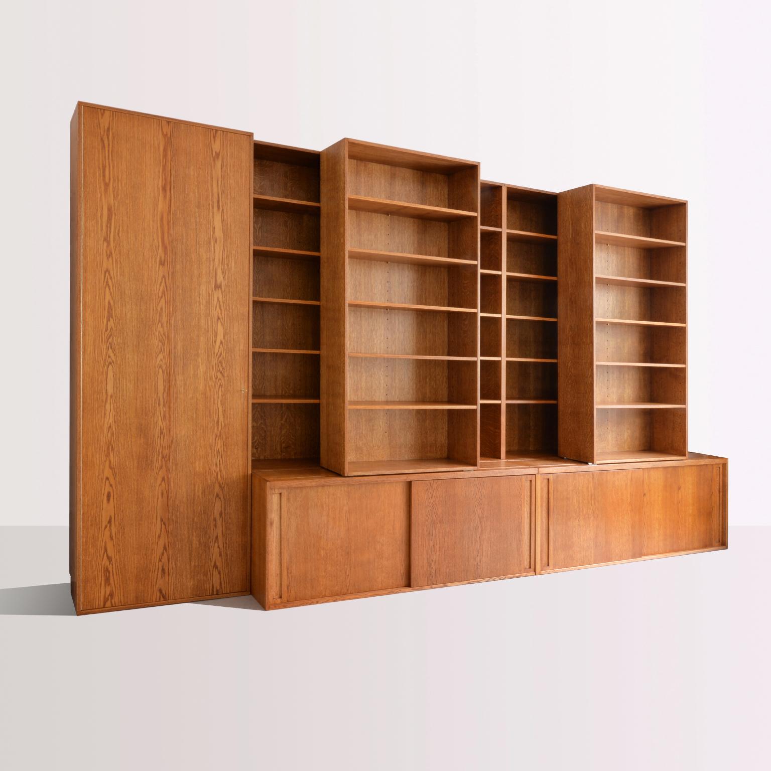 Customized bookshelf in handcrafted wood with sliding and adjustable shelves. The Minimalist contemporary look make it versatile for different kind of interiors and style combinations. The bookshelf is disponible in natural, stained or painted wood.