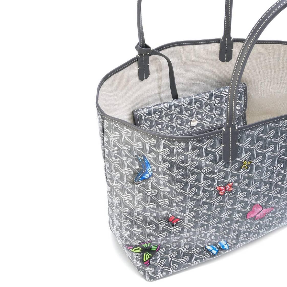 A handbag to truly set your heart aflutter, this grey Monogram St Louis tote Bag was crafted from Goyardine Canvas, a coloured textile made from cotton, linen and hemp, and vitalised by a flurry of hand-painted butterflies, in a mix of refined