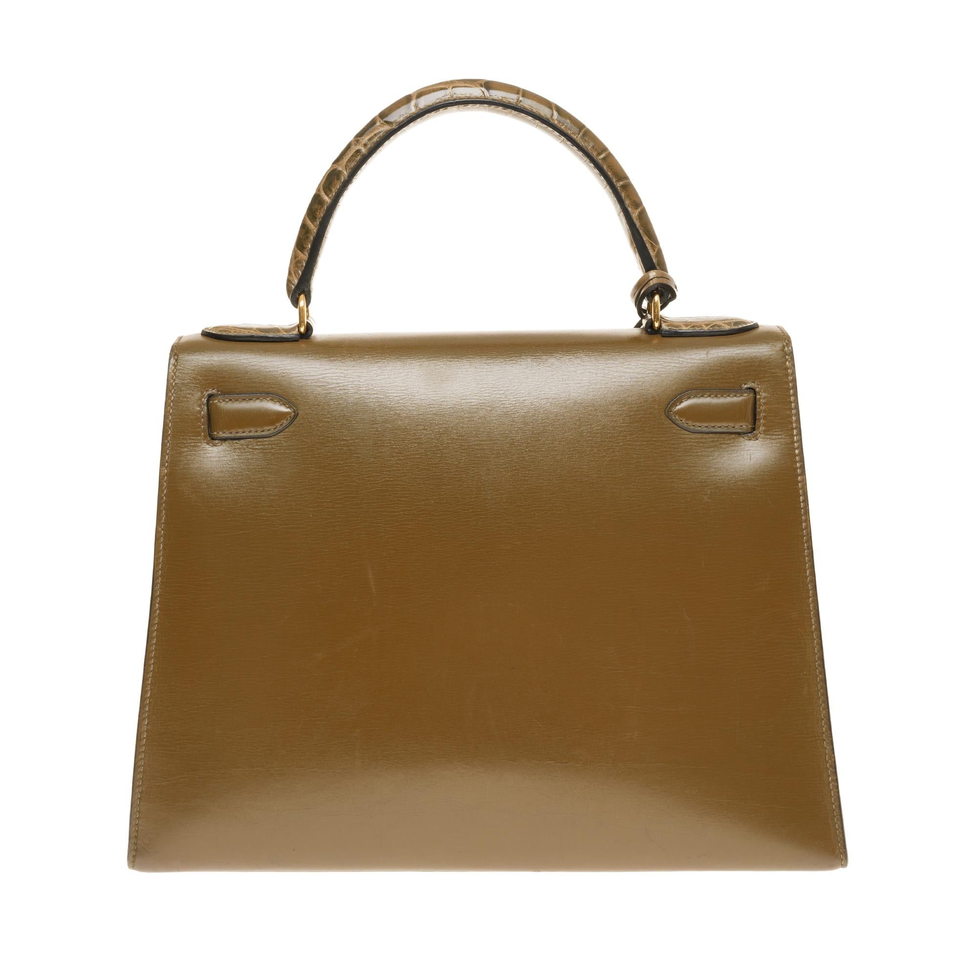 Exceptionnel & Rare Hermès Kelly 28 leather saddler bag box olive green, gold plated metal hardware
This exceptional bag has been customized with olive green Porosus crocodile, enchapes, handle and shoulder strap in green crocodile (not signed),