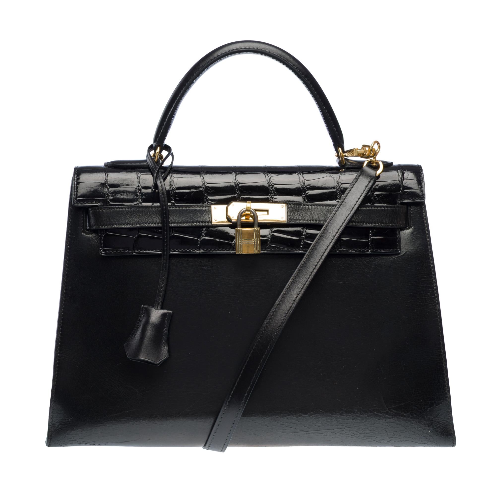 Hermès​ ​Kelly​ ​32​ ​Sellier​ ​handbag​ ​strap​ ​in​ ​black​ ​box​ ​calf​ ​leather​ ​customized​ ​with​ ​black​ ​Crocodile​ ​porosus​ ​top​ ​flap,​ ​removable​ ​black​ ​box​ ​leather​ ​shoulder​ ​strap,​ ​gold​ ​metal​ ​attachments​ ​and​ ​clasp,​