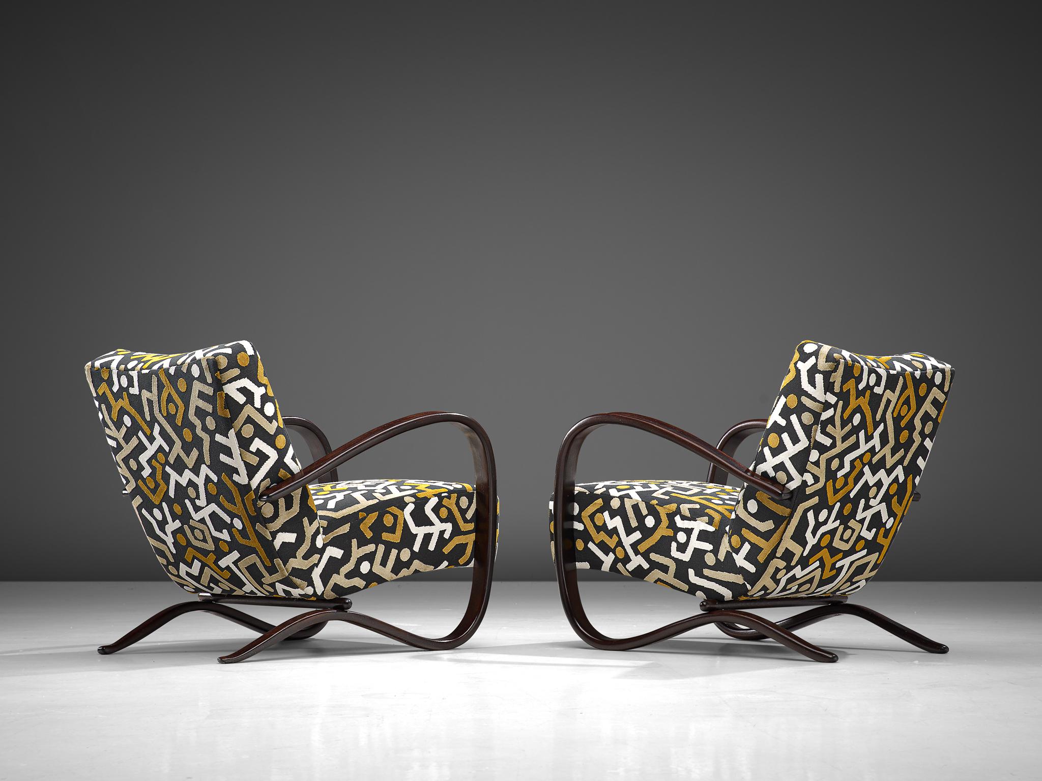 Jindrich Halabala, lounge chairs, reupholstered in Pierre Frey fabric and stained beech, Czech Republic, 1930s. 

These extraordinary pair of Halabala chairs are recently upholstered with a graphical fabric by Pierre Frey, upholstery which is done