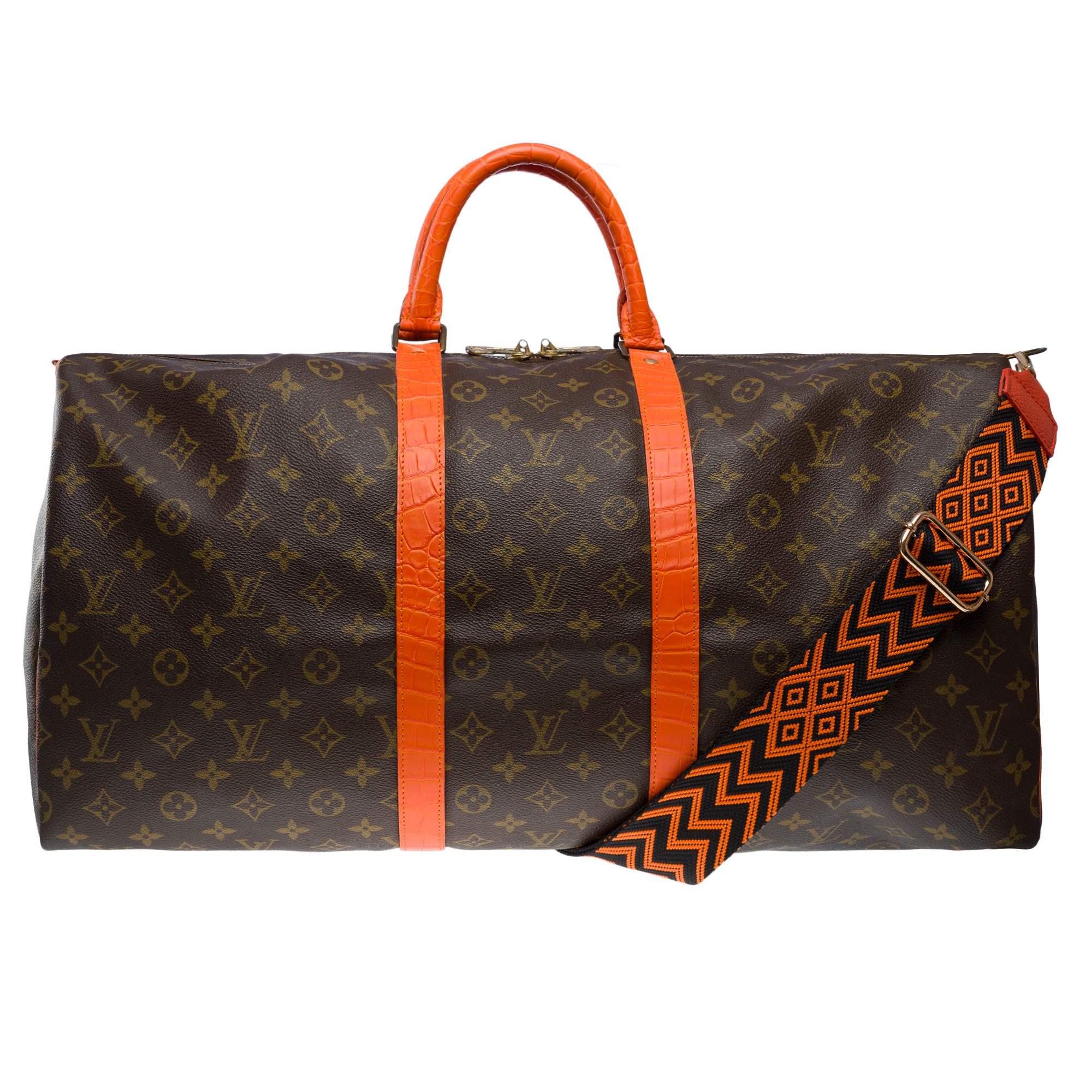 Exceptional​ ​and​ ​Unique​ ​Louis​ ​Vuitton​ ​Keepall​ ​55​ ​Travel​ ​bag​ ​in​ ​brown​ ​monogram​ ​coated​ ​canvas​ ​customized​ ​with​ ​genuine​ ​Orange​ ​Crocodile​ ​Porosus​ ​leather​ ​to​ ​the​ ​handles​ ​and​ ​on​ ​the​ ​belly​ ​bands

Gilt​