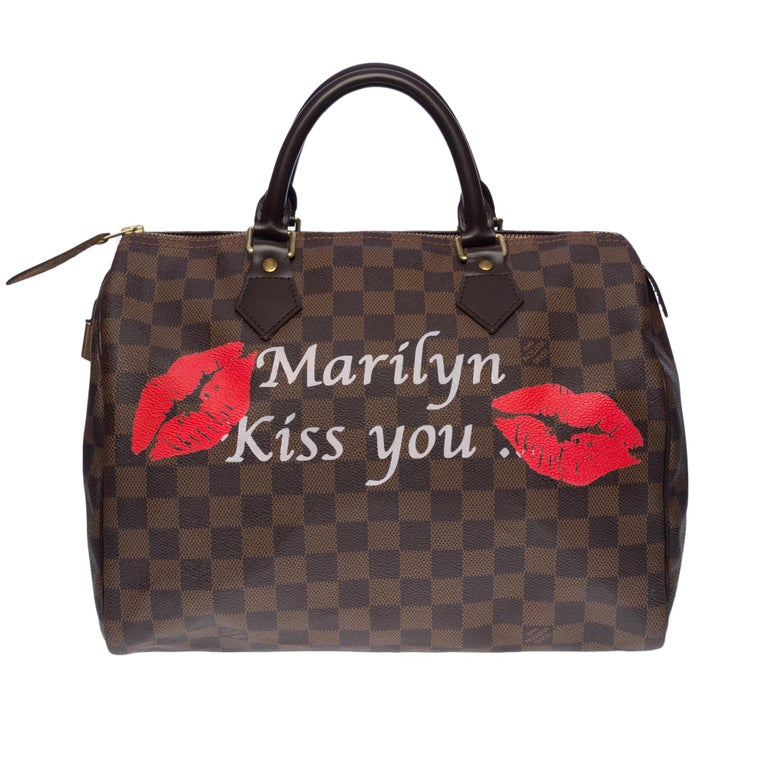This beautiful customized bag features Marilyn Monroe and the famous cartoon character the Pink Panther

Crafted in graphic Damier Ebony canvas, this elegant Speedy 30 bag is a compact model ideal for city life. Appearing in 1930 under the name of