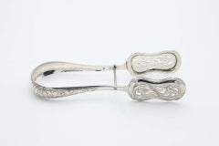 Cut and embossed silver tongs for bread or salads