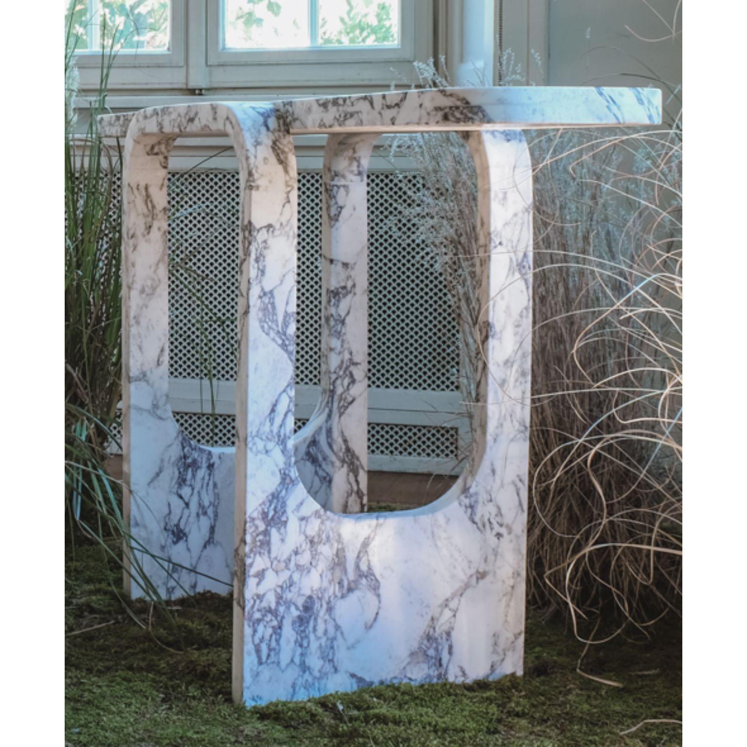 Cut and fold console by dAM Atelier
One of a kind.
Dimensions: L 147 x W 42 x H 80 cm.
Materials: Calacatta Viola marble.

Cutting and folding means creating a whole new element through the sequence of two simple actions. Starting from a