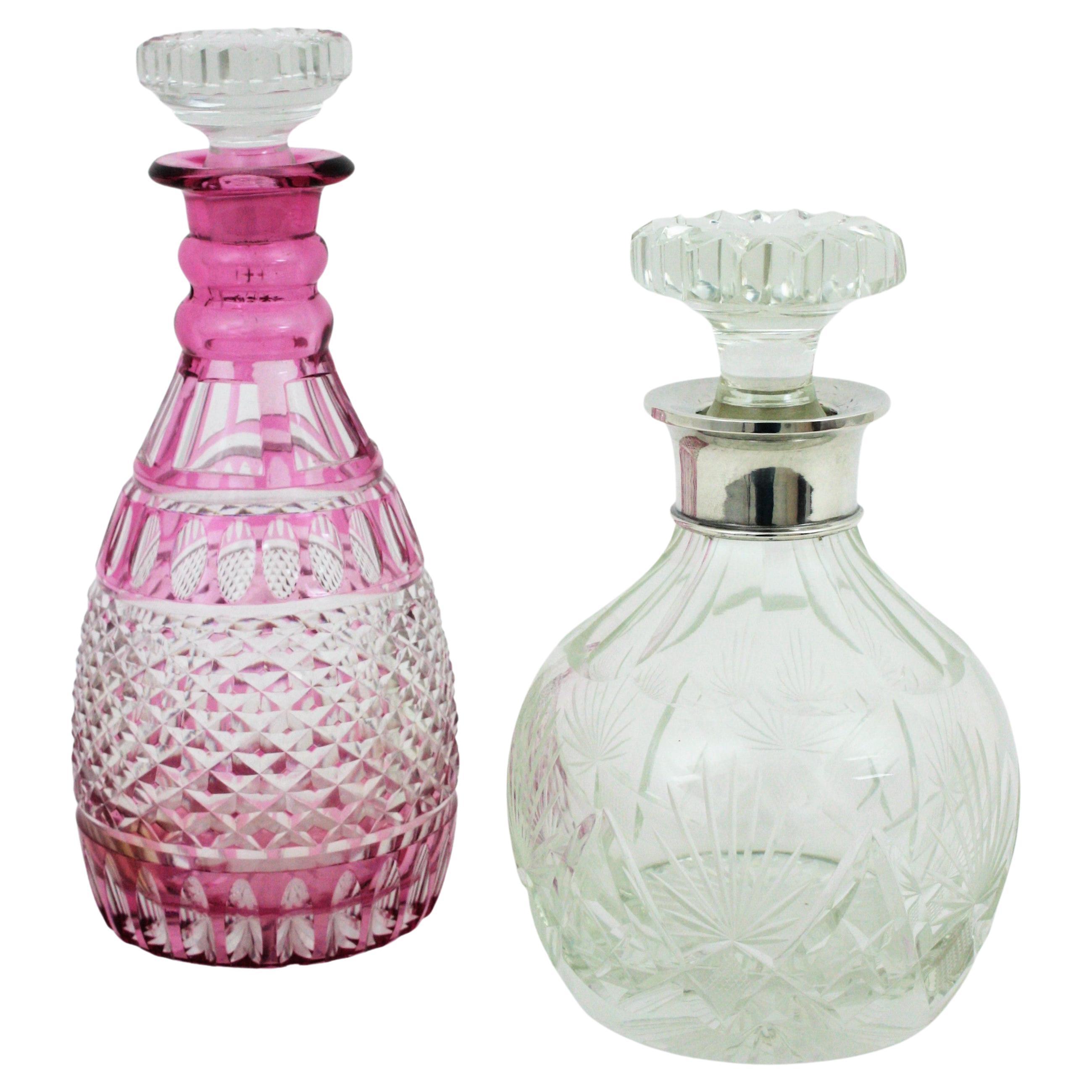Unmatching pair of Art Deco cut crystal and silver decanters with stoppers. Spain, 1930-1950s
These spirits /drinks decanters are finely executed in clear glass and pink glass.
Each bottle features cut all over patterns and cut crystal stoppers. The