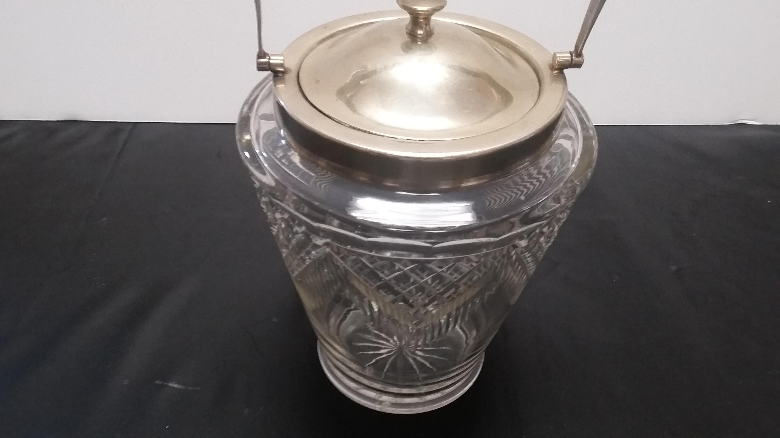 Beautiful cut crystal biscuit jar from England. Late 19th century (circa 1870) with silver plated top and rim. Diamond pattern to the crystal.