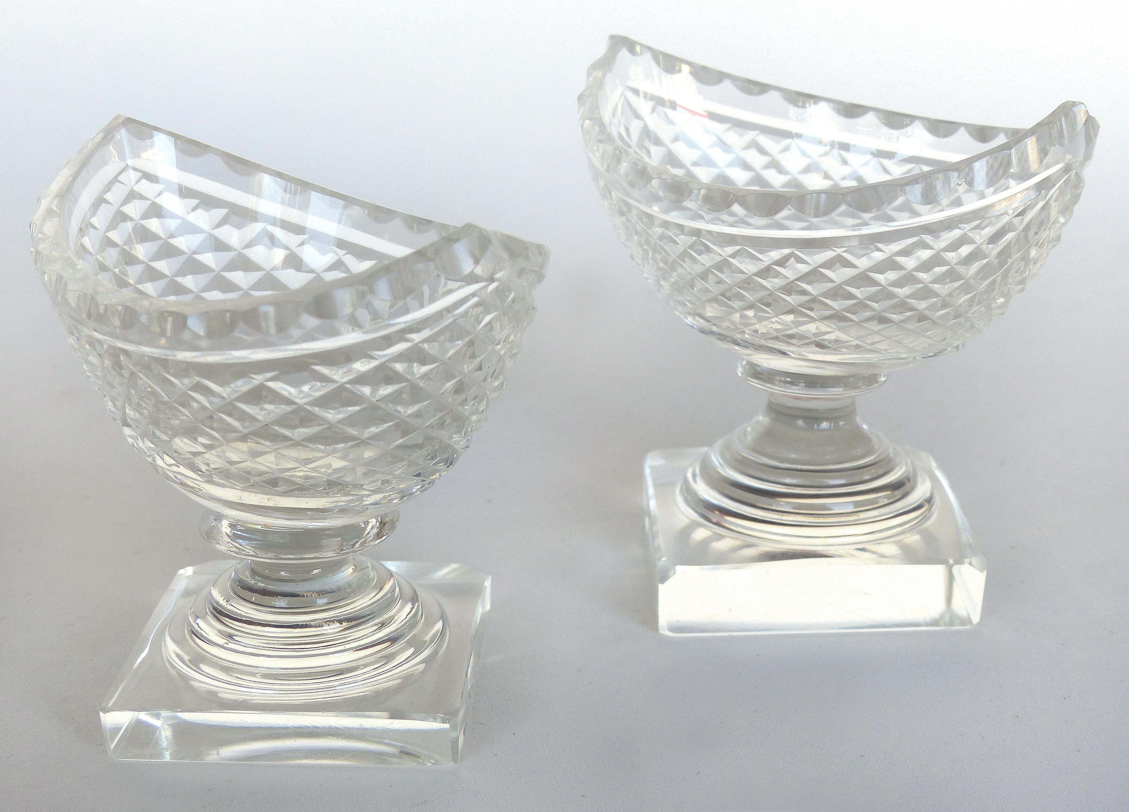 Cut Crystal Condiment Boats

Offered for sale is a heavy cut crystal pair of boat-shaped containers for condiments. The pieces are created with a Classic form and sit diagonally on the substantial bases. The measurements given below are with the