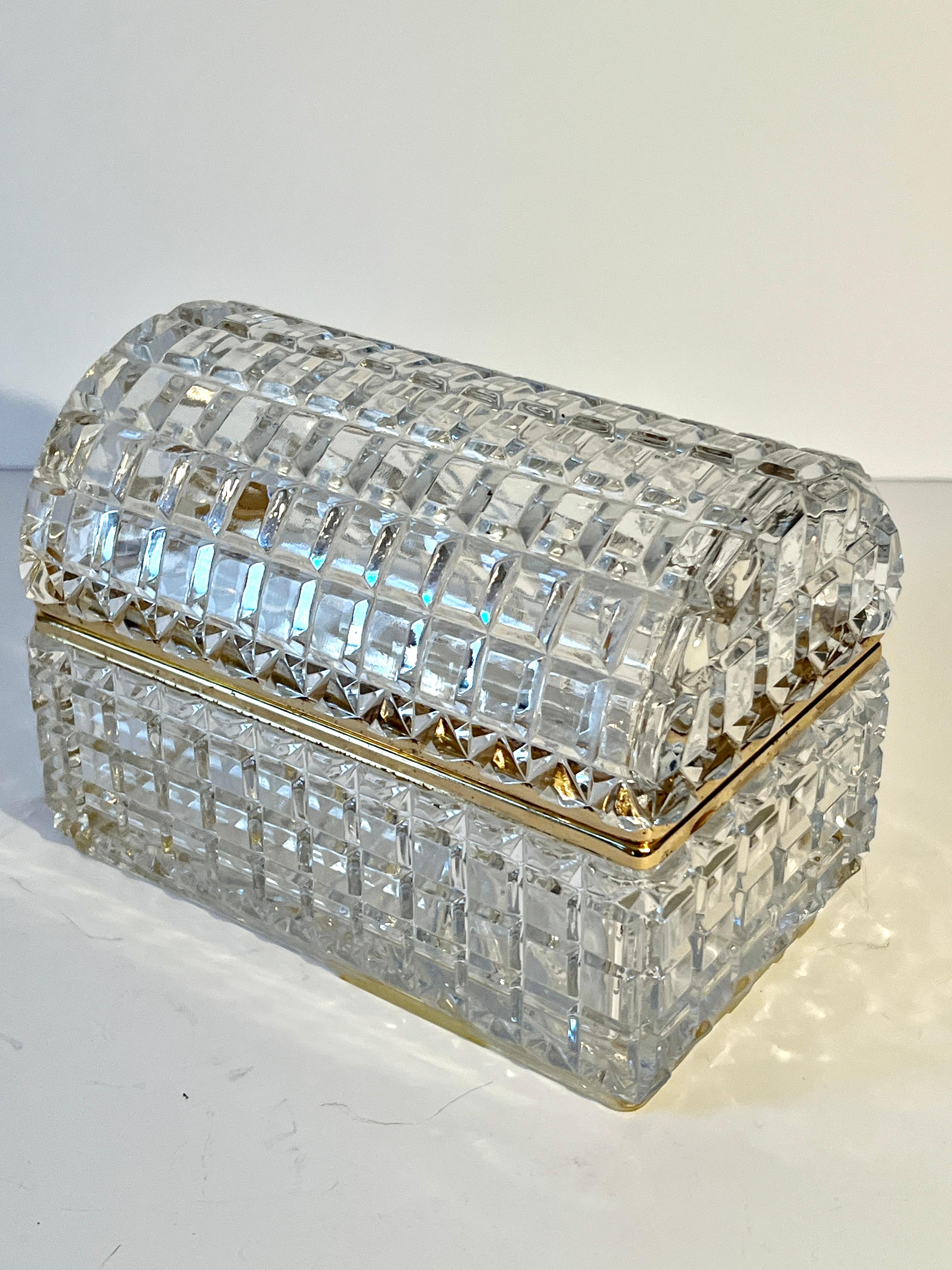 A magnificent cut crystal Box with Brass closure and hinge.  The condition is very good with no chips or cracks.  

A compliment to any cocktail table, desk, side table or work station.  The box can hold everything from entry keys, to letters,