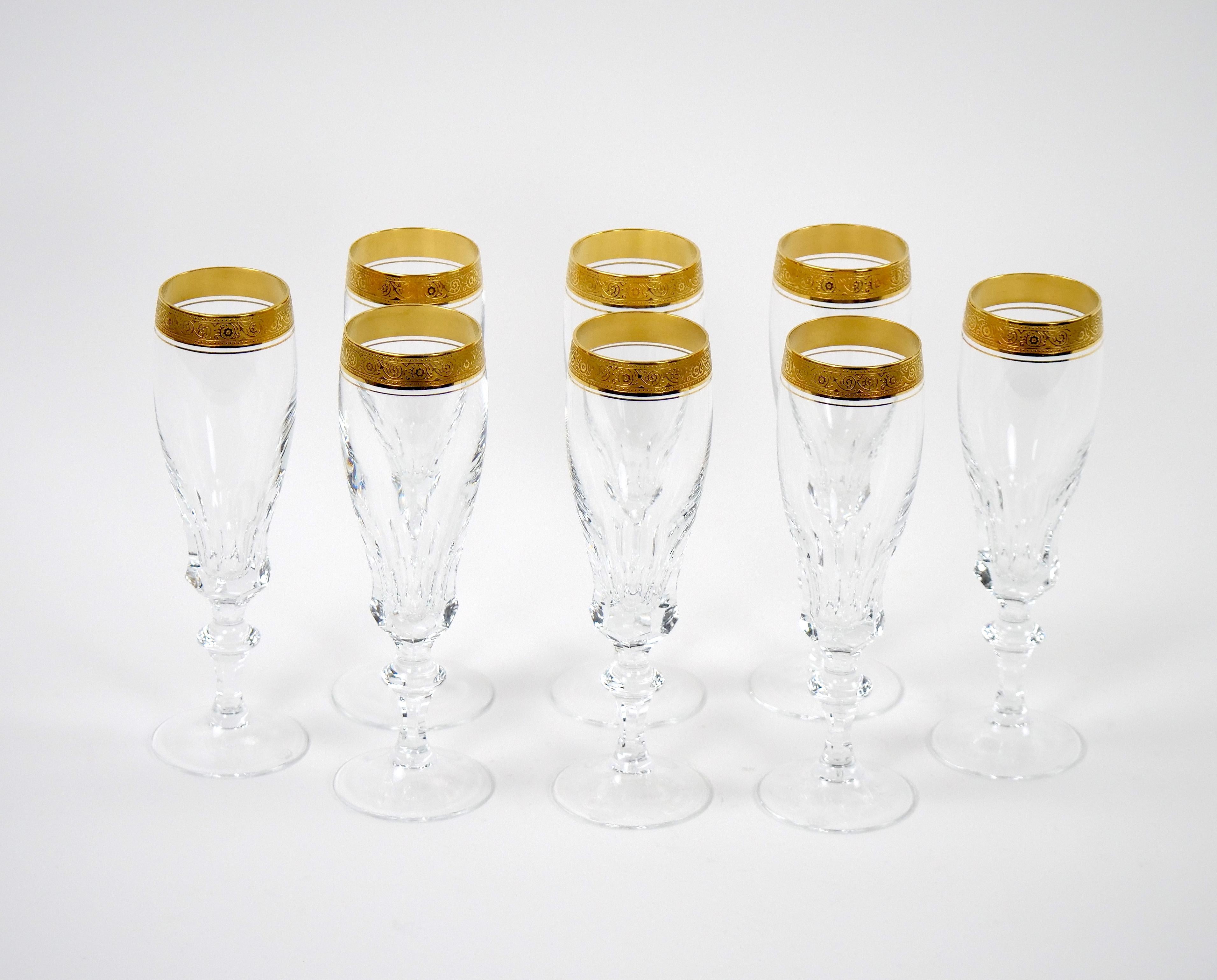 Introducing an embodiment of sheer opulence & refined taste with this meticulously crafted cut crystal tall champagne flute service, a masterpiece that redefines luxury living. Adorned with meticulous double trimmings of gilt gold, each piece