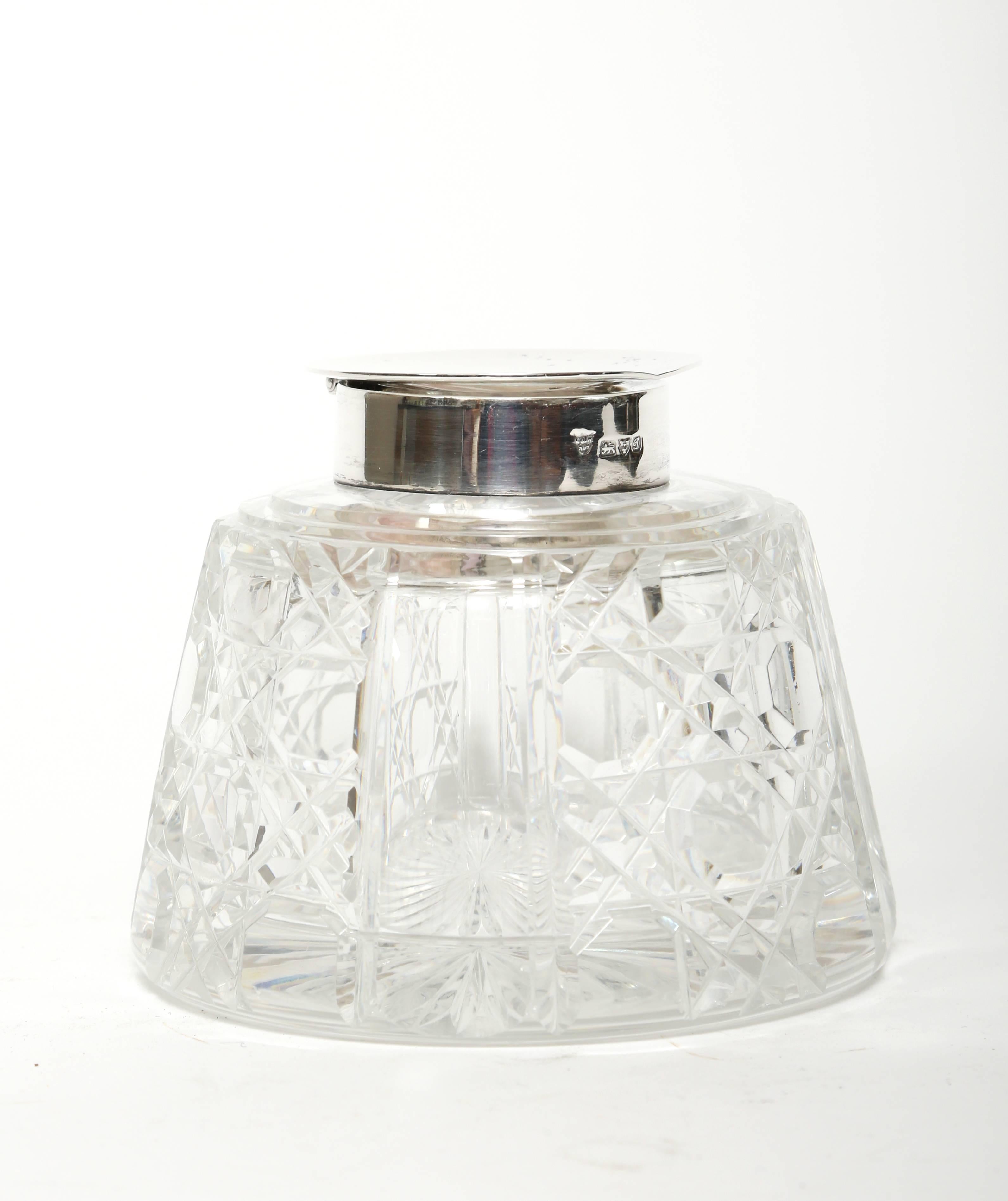 Large Edward VII period cane cut crystal inkwell with sterling silver hallmarked top and star cut base. The hallmarks on the collar are from Chester, England 1904.

(This item is eligible for a gift box)