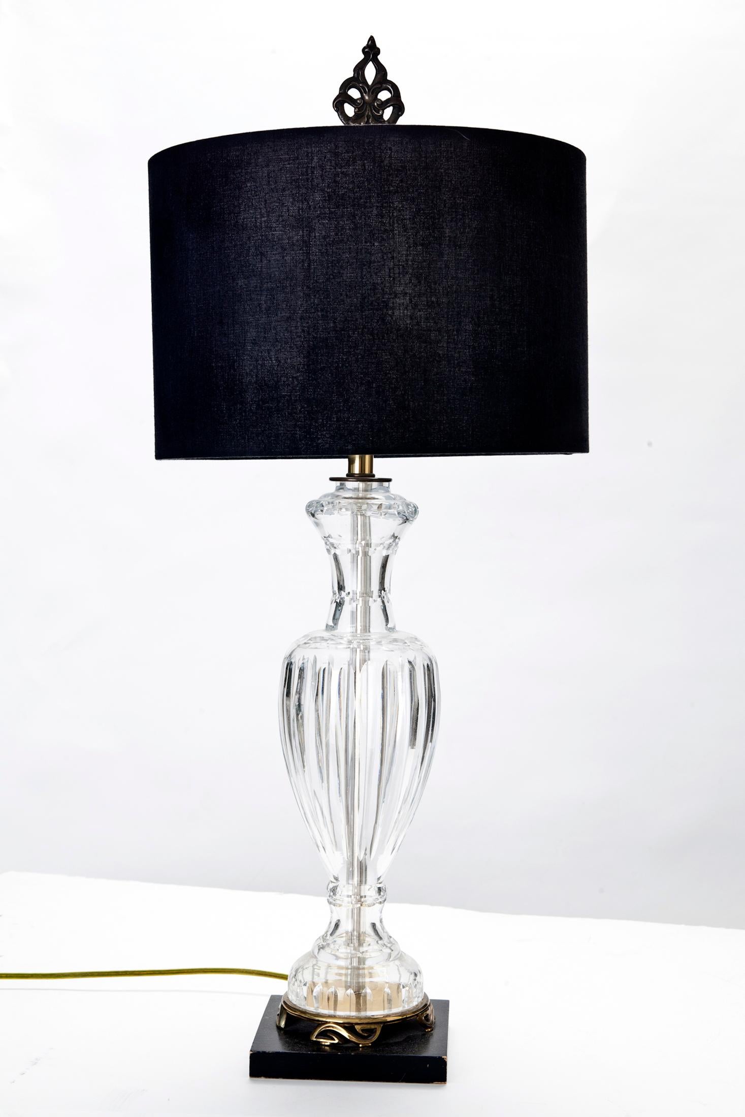 Stunning cut crystal table lamp attributed to Waterford, with ebony & brass base.
Shown with natural linen & black shades, both are available for an addition charge, with your inquiry.
Beautiful Brass finial is included.